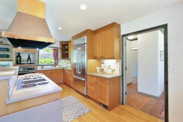 a living room with furniture and a mirror