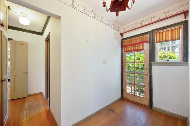 a bathroom with a sink mirror vanity and toilet