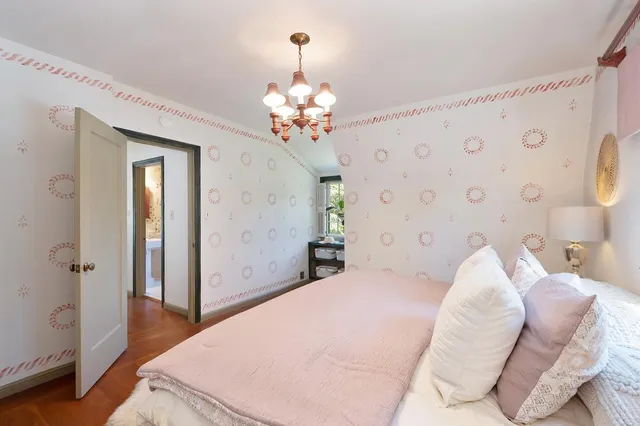 a bathroom with a sink mirror and toilet