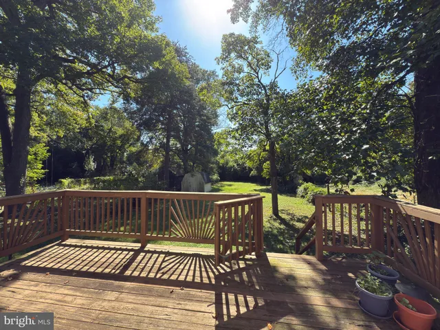 a view of a wooden deck with furniture