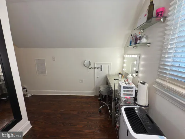 a room with furniture and wooden floor