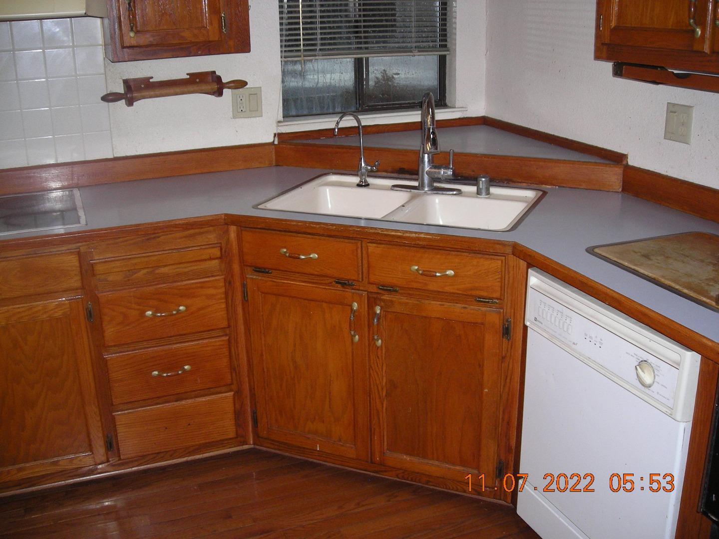 77 Crespi, Unit 77 Watsonville, CA 95076 - Photo 16 of 19 a kitchen with a sink and a wooden cabinets