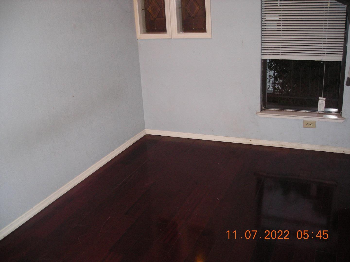 77 Crespi, Unit 77 Watsonville, CA 95076 - Photo 4 of 19 a view of an empty room with wooden floor and a fireplace