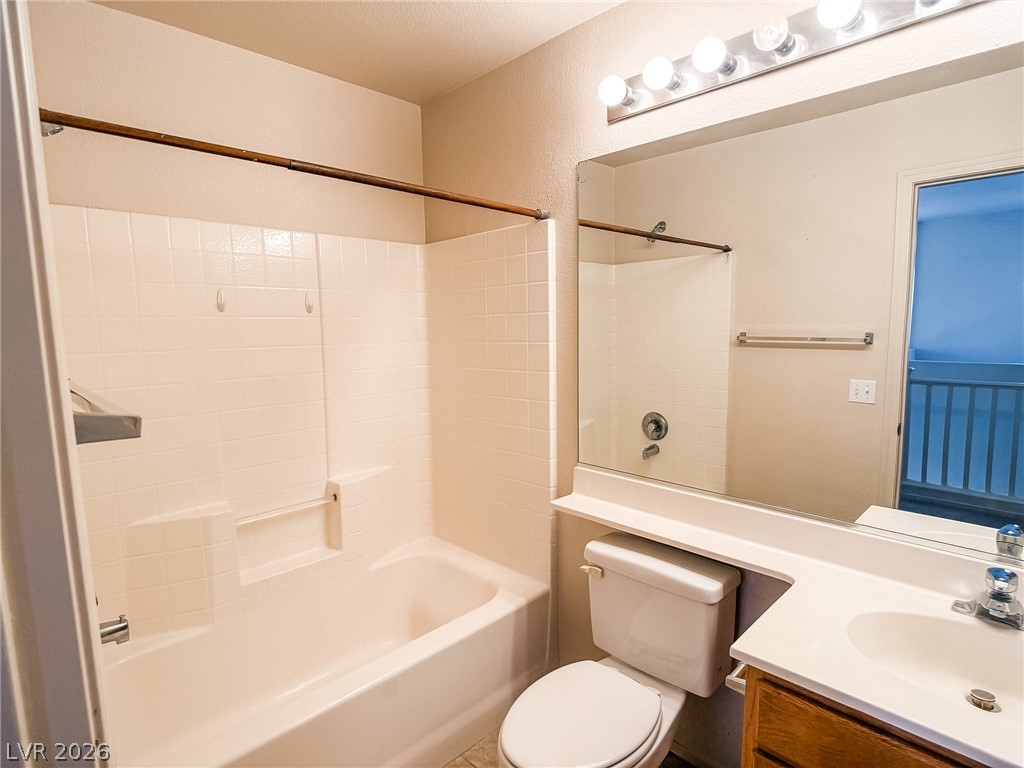 228 Positive Point Street Henderson, NV 89012 - Photo 22 of 27 Functional full bathroom featuring a tub and shower combination with clean tile surround.