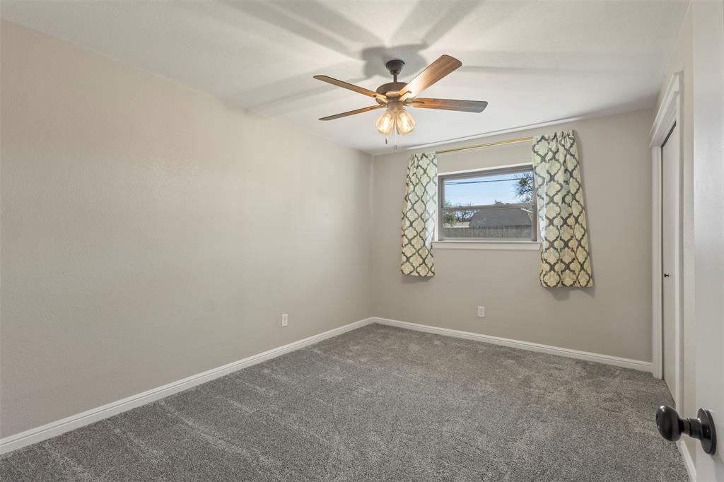3009 Ranch House Road Willow Park, TX 76087 - Photo 18 of 40 an empty room with windows and fan