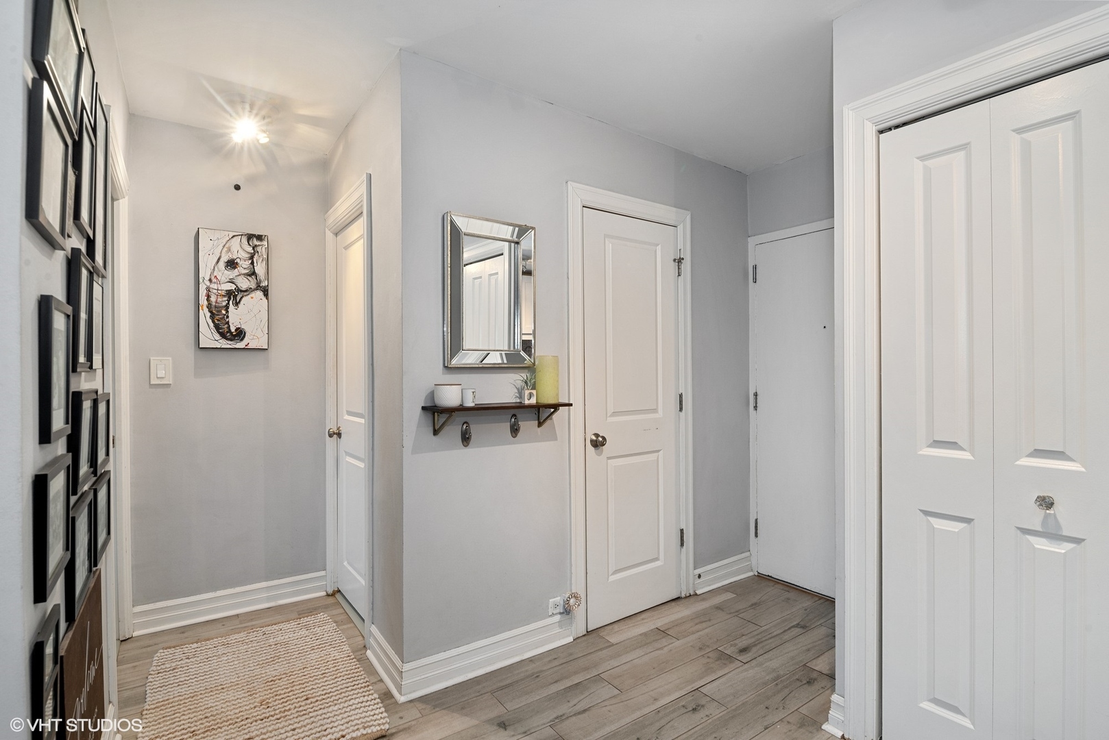 2930 North Sheridan Road, Unit 1611 Chicago, IL 60657 - Photo 2 of 18 a view of a hallway with closet and wooden floor