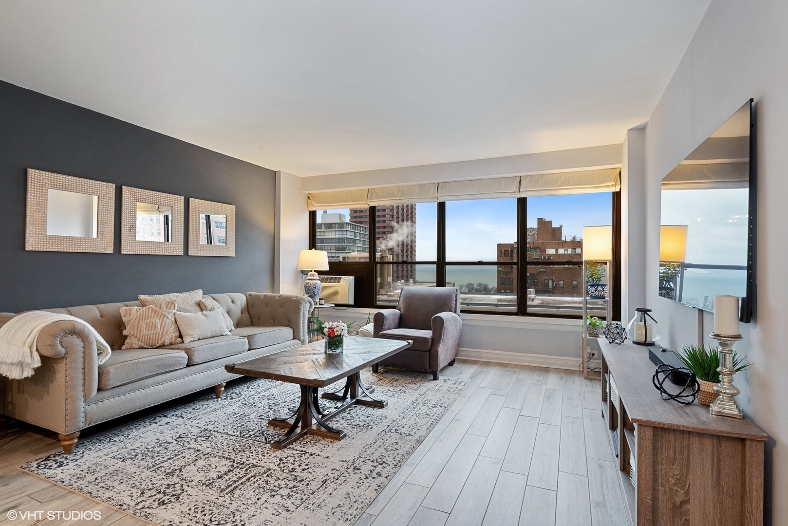 2930 North Sheridan Road, Unit 1611 Chicago, IL 60657 - Photo 3 of 18 a living room with furniture and a large window