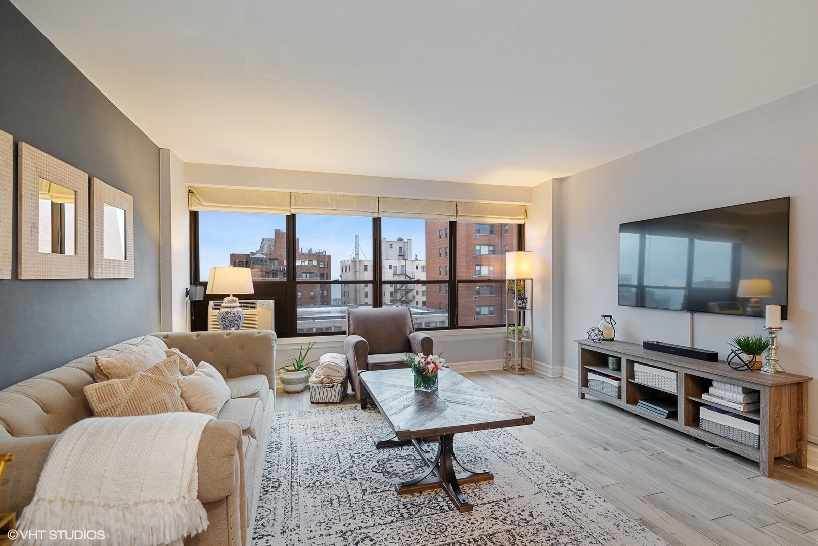 2930 North Sheridan Road, Unit 1611 Chicago, IL 60657 - Photo 4 of 18 a living room with furniture and a wooden floor