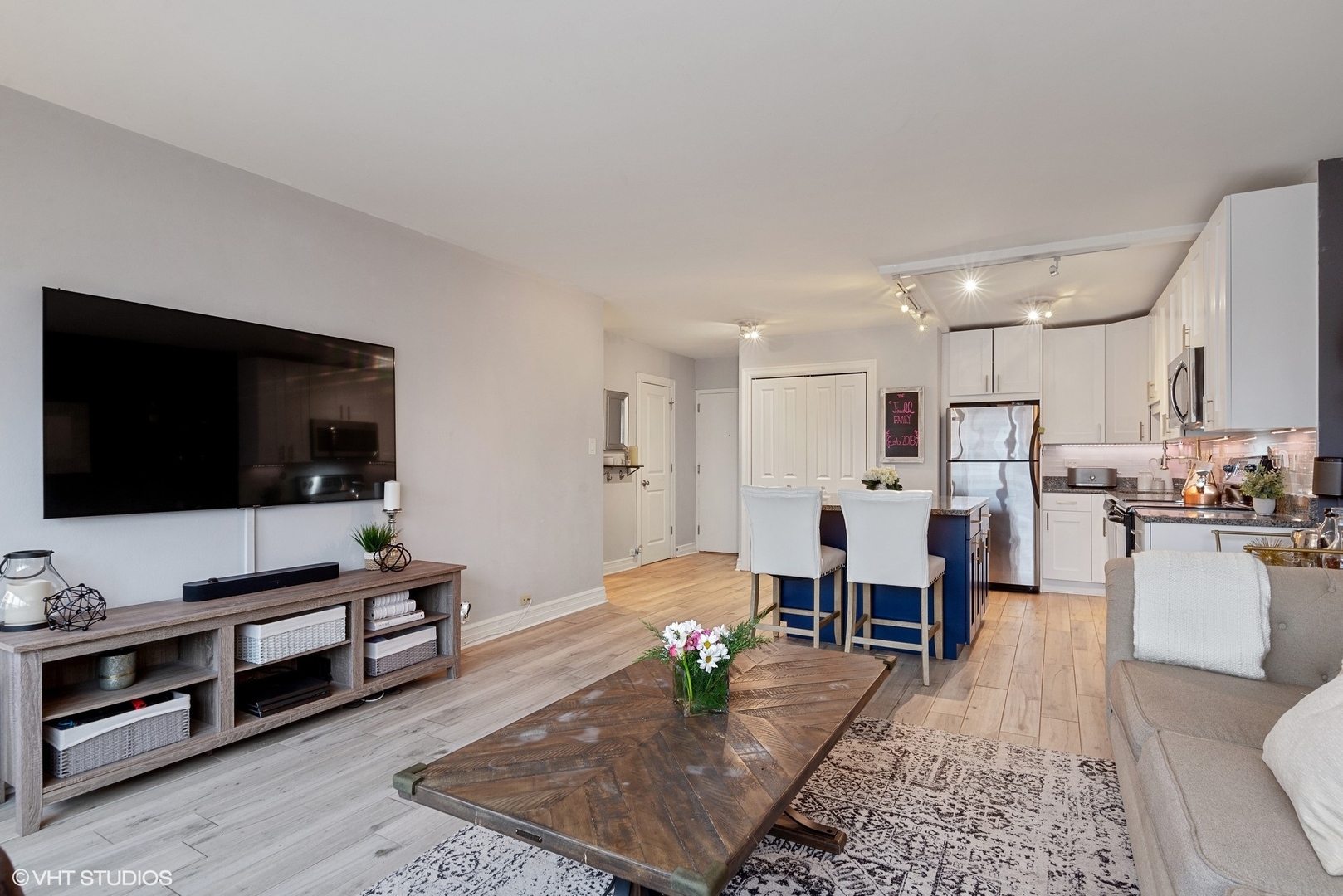2930 North Sheridan Road, Unit 1611 Chicago, IL 60657 - Photo 9 of 18 a living room with furniture and a flat screen tv