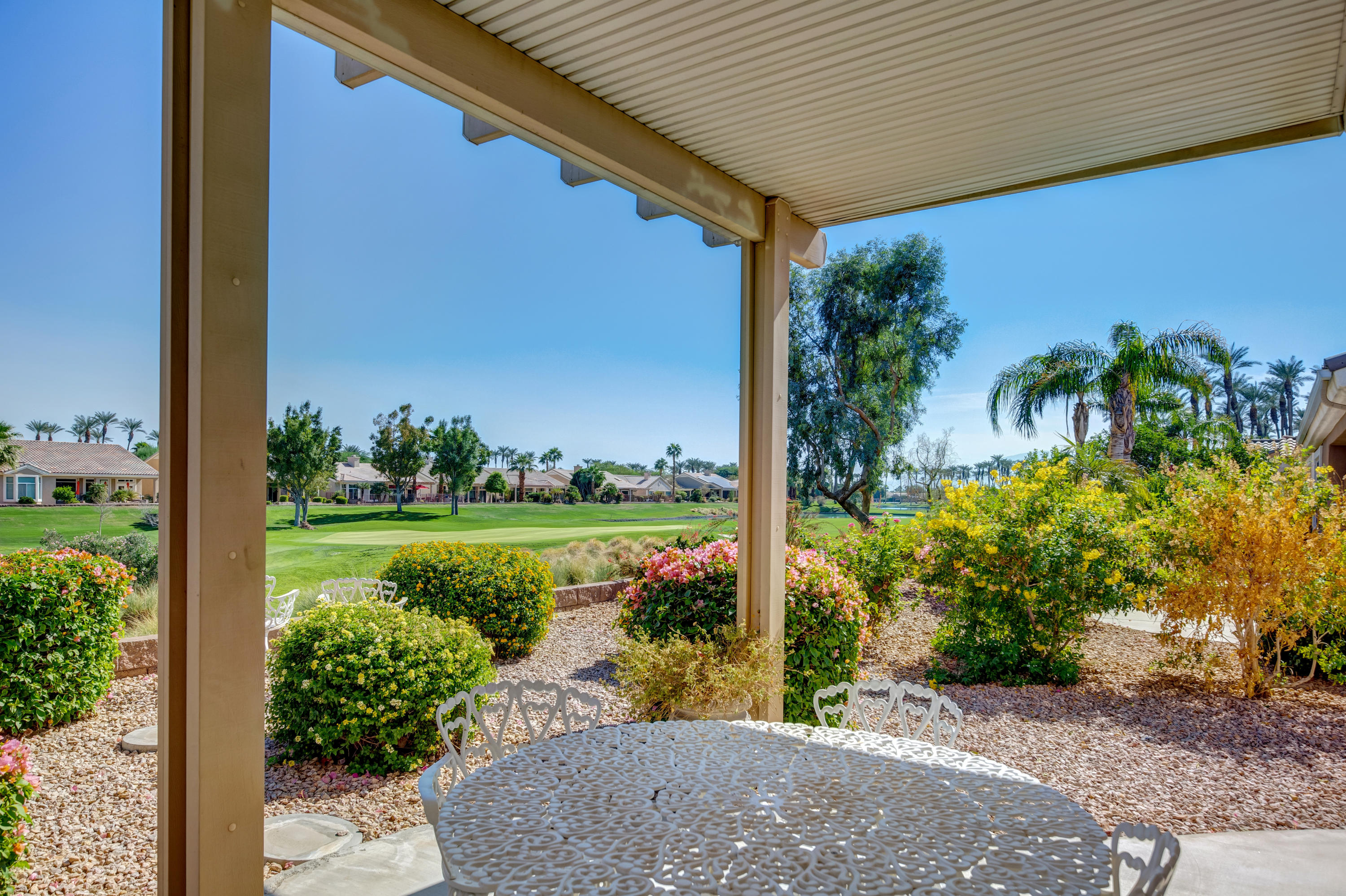 35076 Moorbrook Road Palm Desert, CA 92211 - Photo 2 of 45 a view of a garden with lake