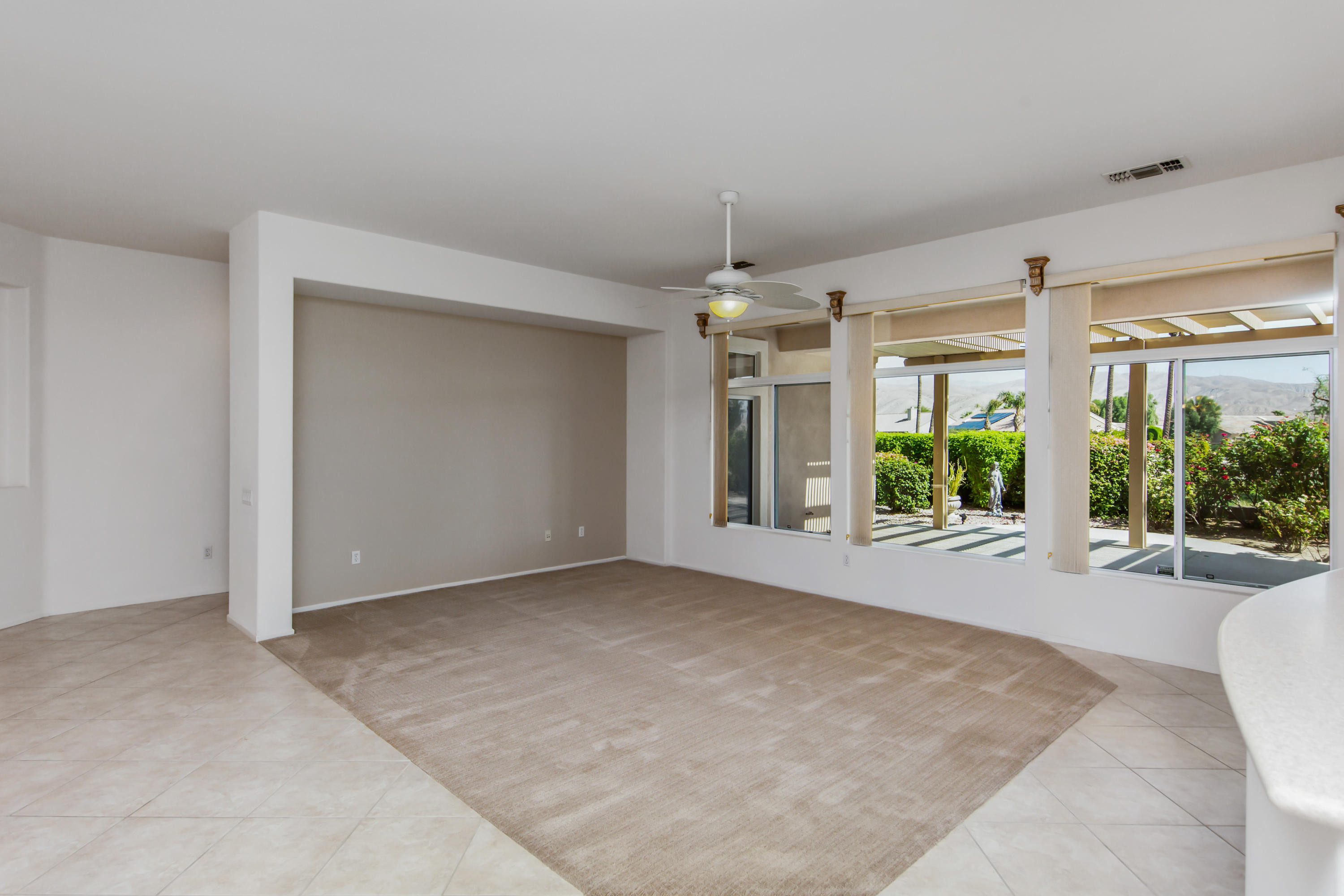 35076 Moorbrook Road Palm Desert, CA 92211 - Photo 11 of 45 en empty room with windows and outdoor view