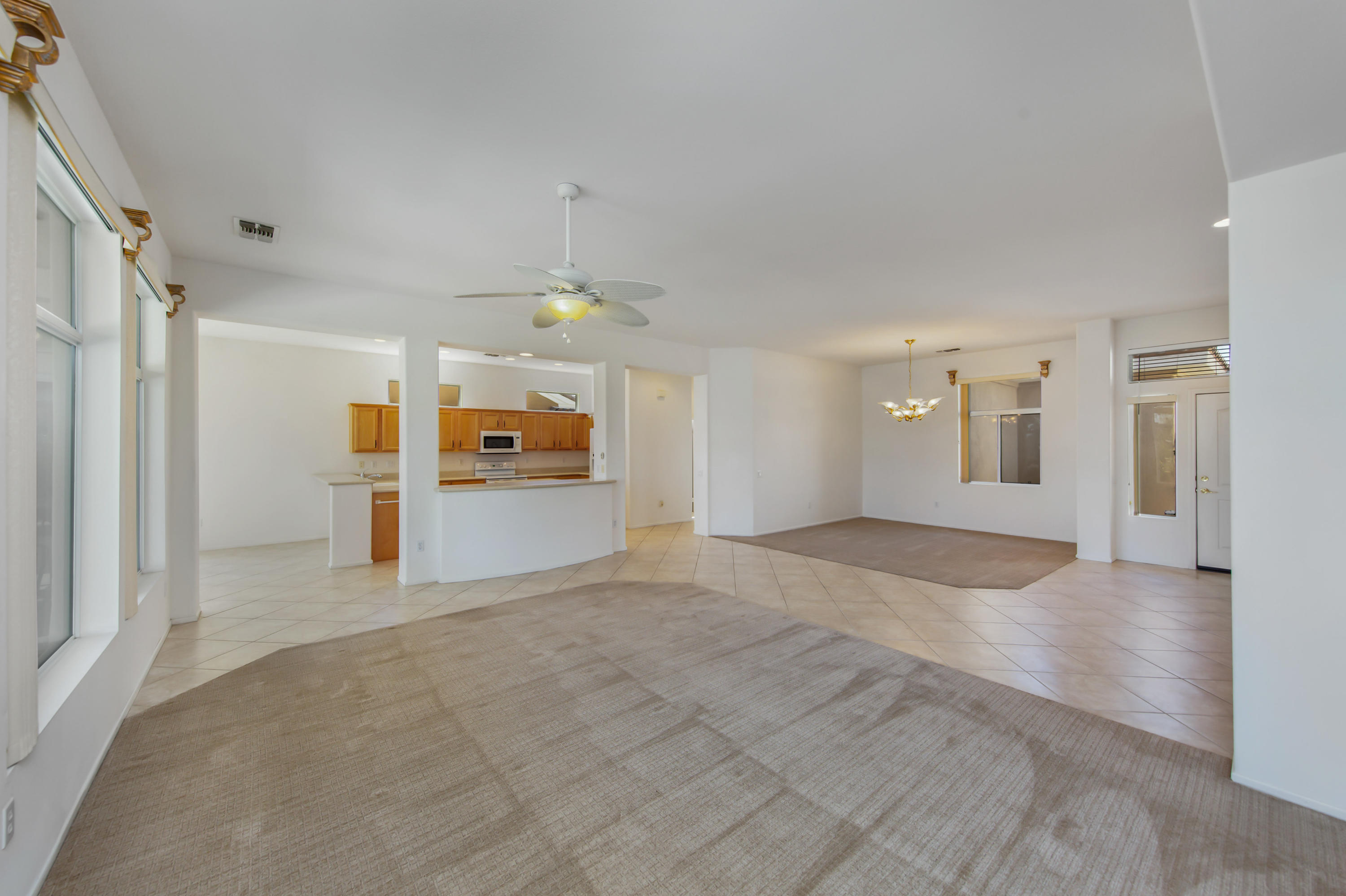 35076 Moorbrook Road Palm Desert, CA 92211 - Photo 12 of 45 a view of a big room with wooden floor and windows
