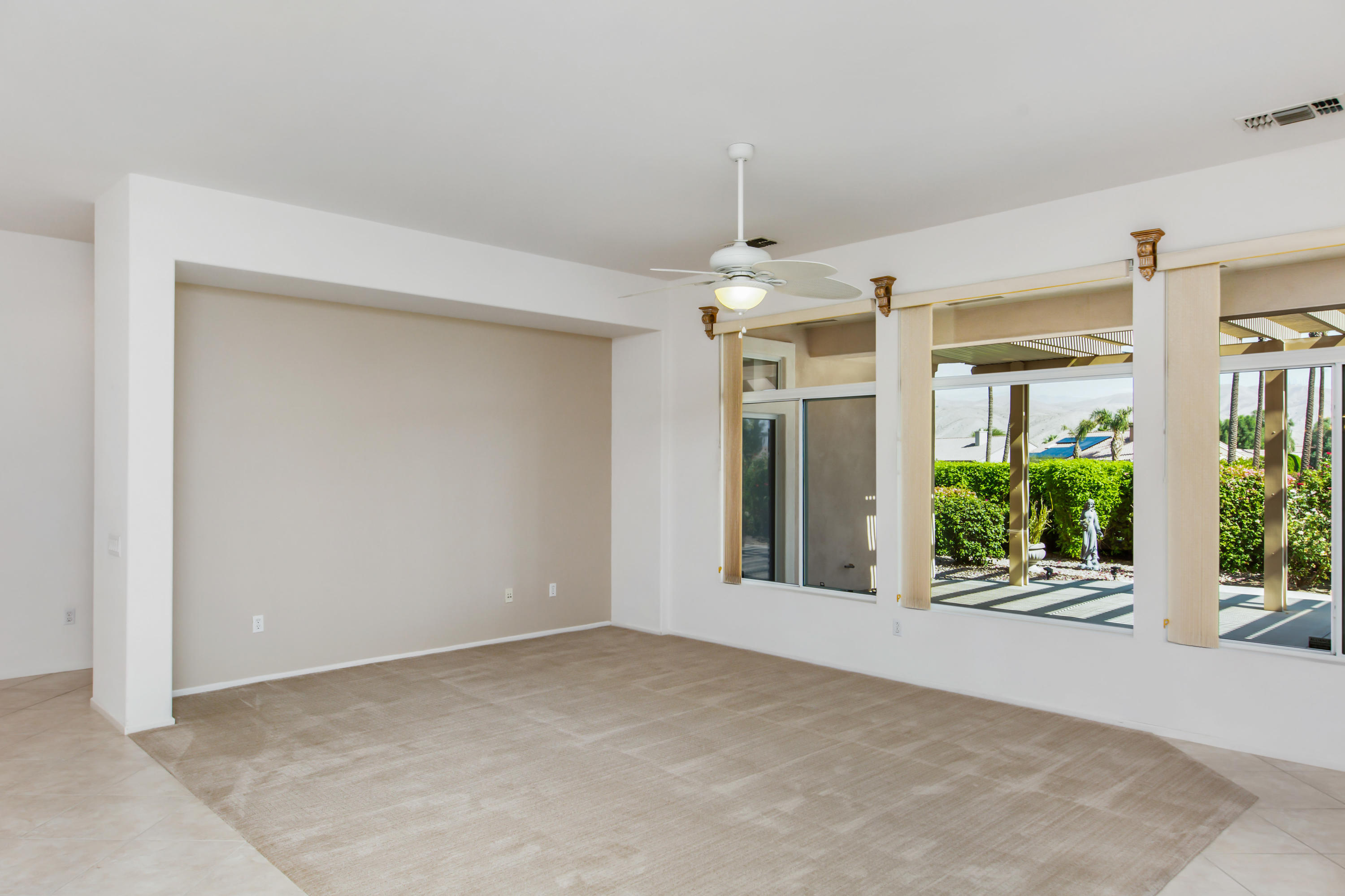 35076 Moorbrook Road Palm Desert, CA 92211 - Photo 13 of 45 a view of an empty room with a window