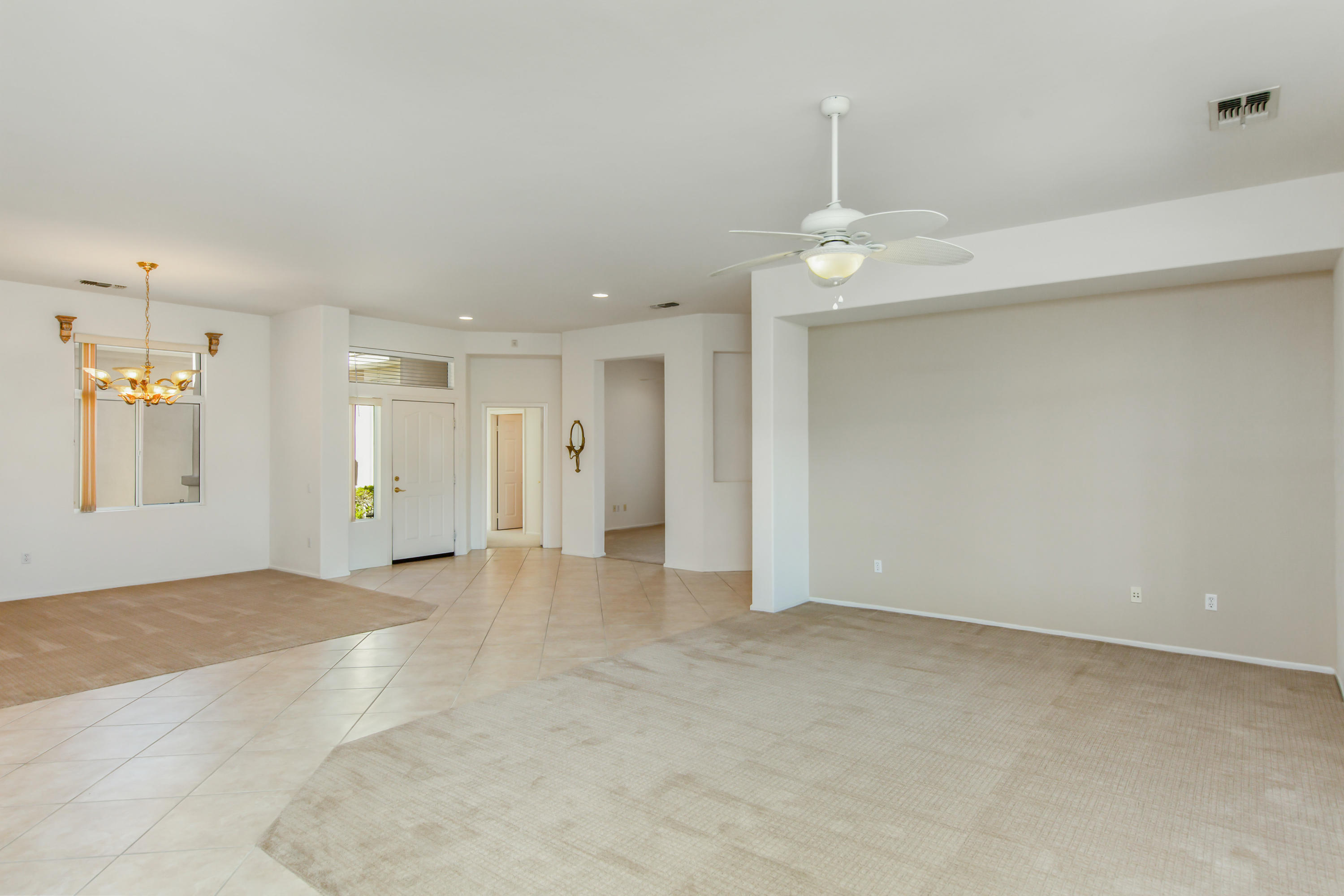 35076 Moorbrook Road Palm Desert, CA 92211 - Photo 14 of 45 wooden floor in an empty room with a window