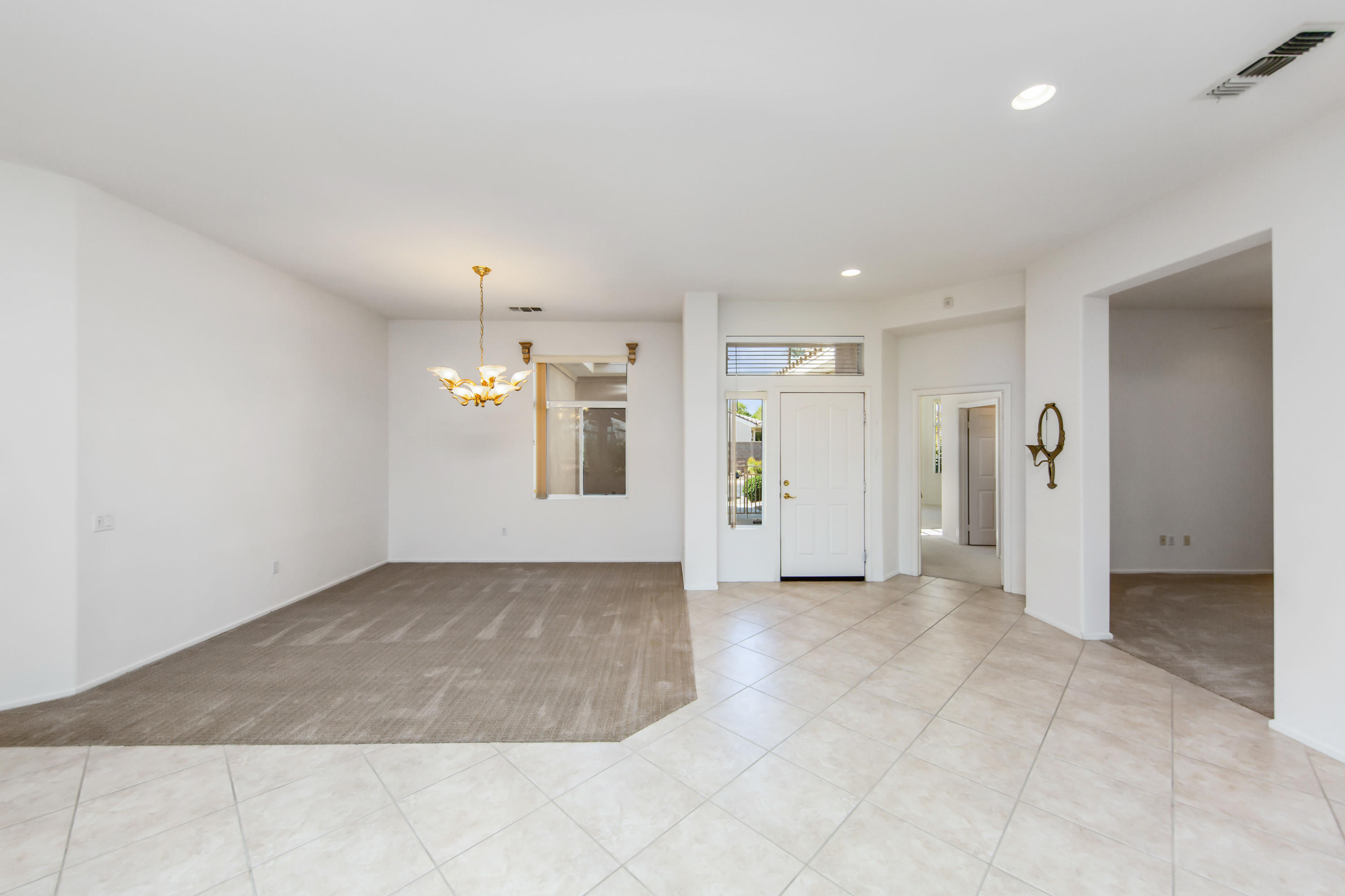 35076 Moorbrook Road Palm Desert, CA 92211 - Photo 15 of 45 an empty room with kitchen and windows