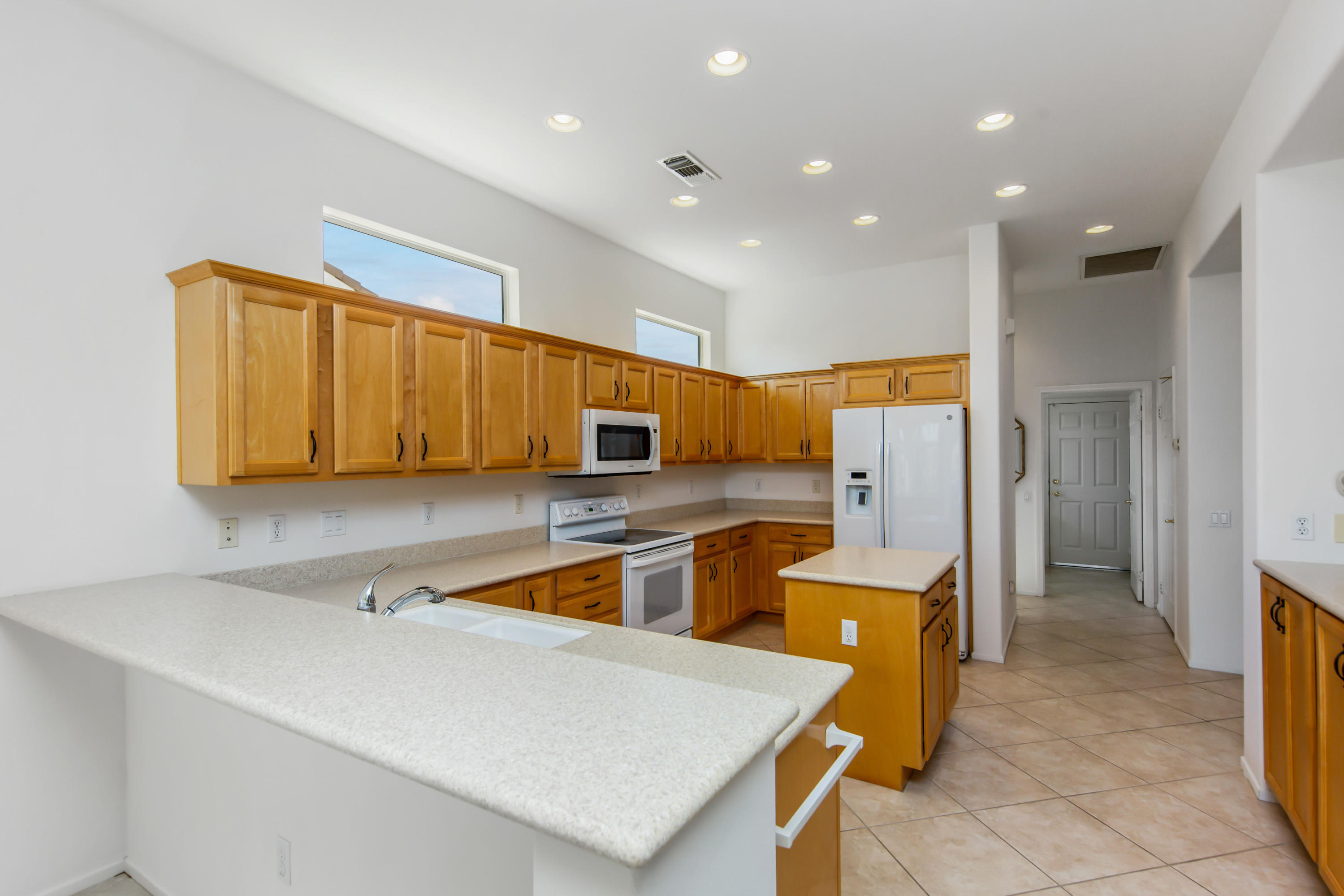 35076 Moorbrook Road Palm Desert, CA 92211 - Photo 19 of 45 a kitchen with a sink a counter top space stainless steel appliances and cabinets