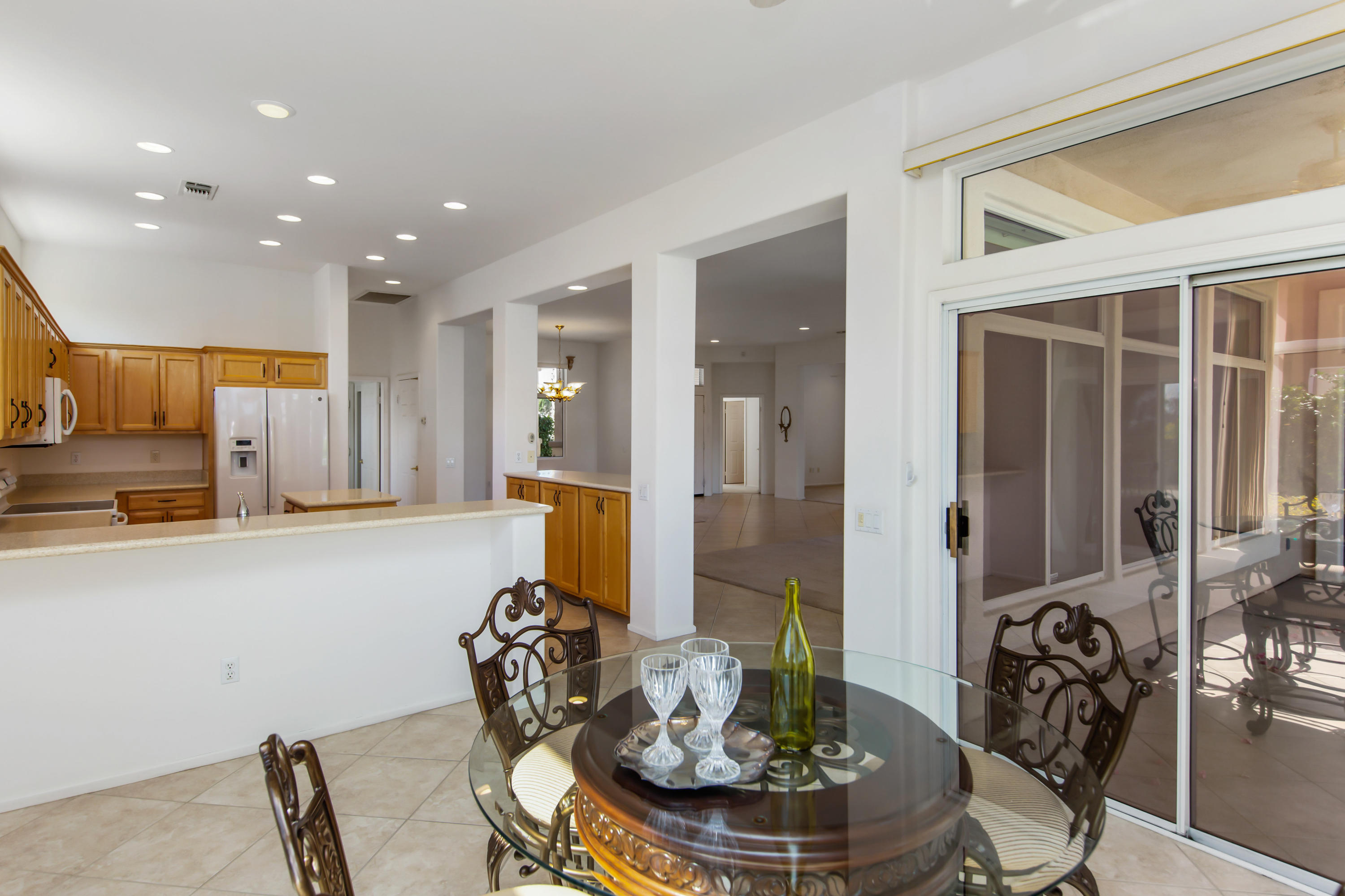 35076 Moorbrook Road Palm Desert, CA 92211 - Photo 21 of 45 a living room with furniture and a dining table