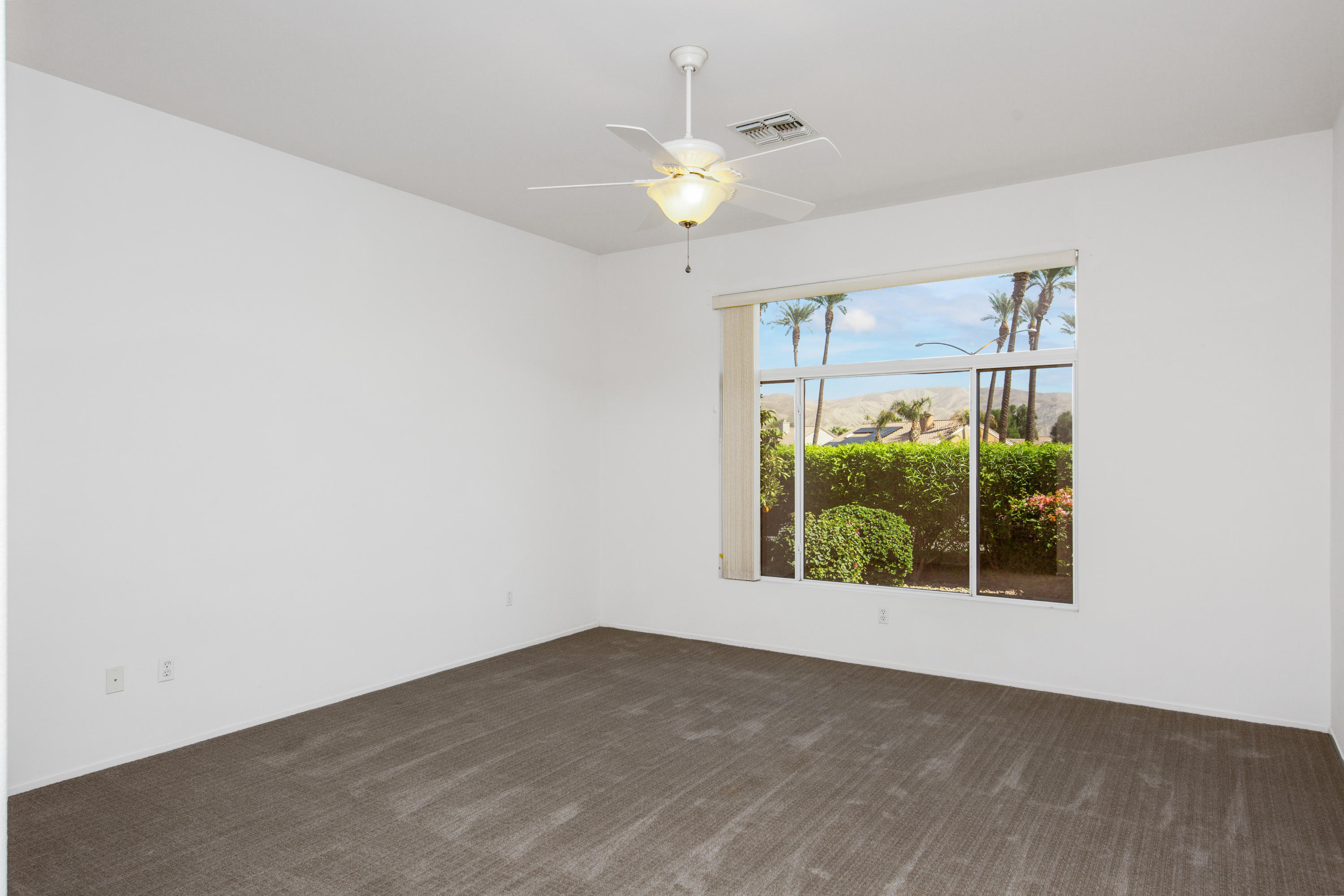 35076 Moorbrook Road Palm Desert, CA 92211 - Photo 23 of 45 an empty room with a window