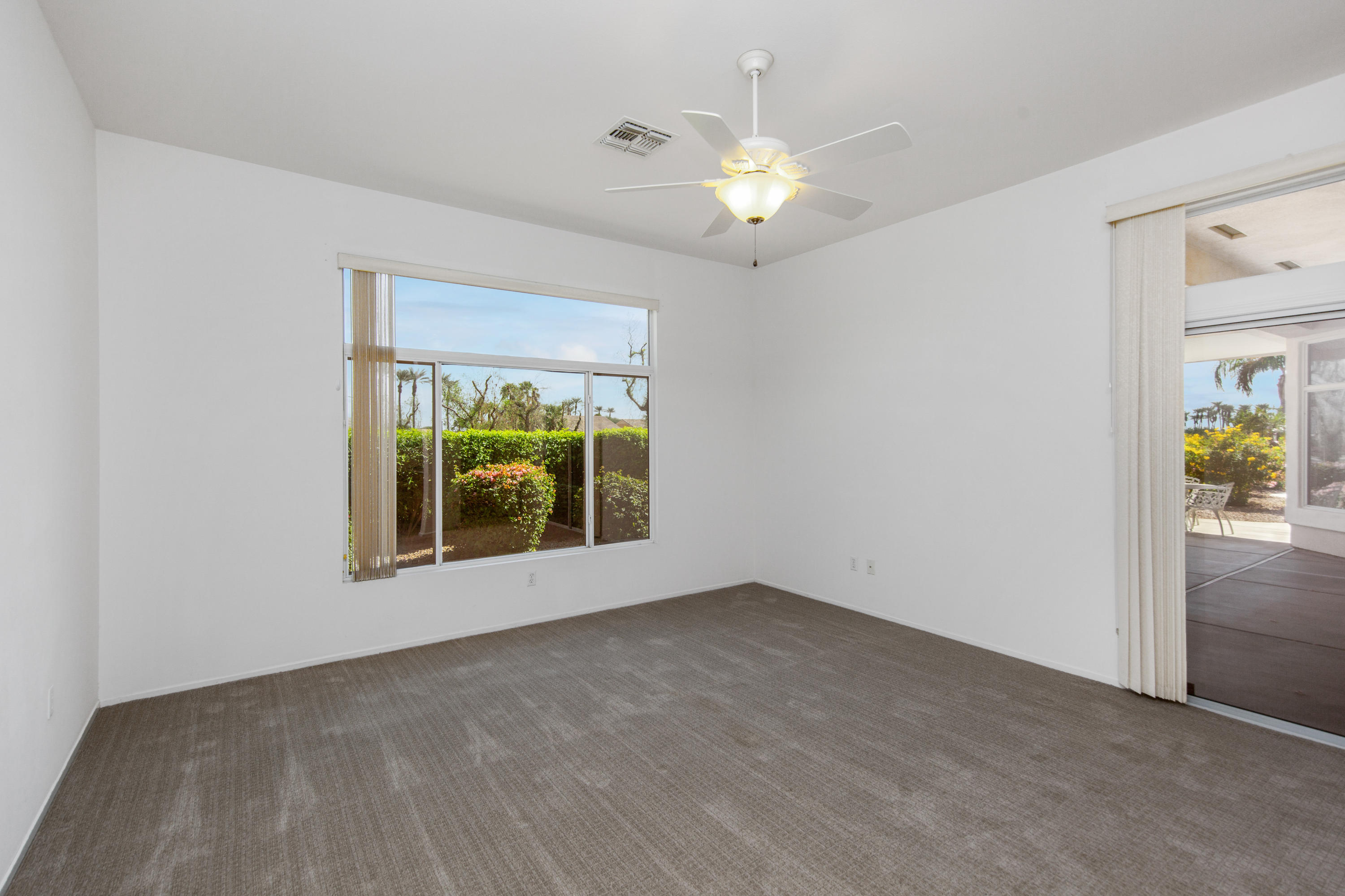 35076 Moorbrook Road Palm Desert, CA 92211 - Photo 24 of 45 a view of an empty room with a window