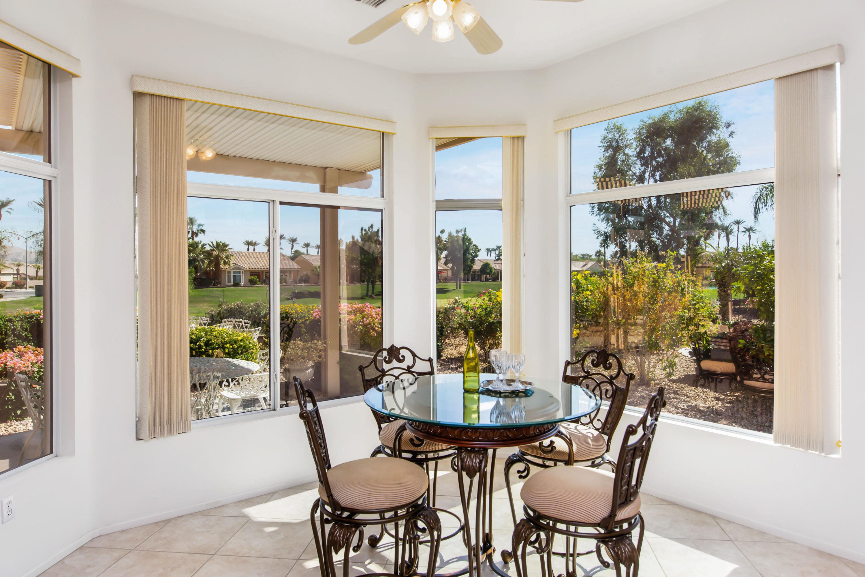35076 Moorbrook Road Palm Desert, CA 92211 - Photo 4 of 45 a view of a dining room with furniture window and outside view