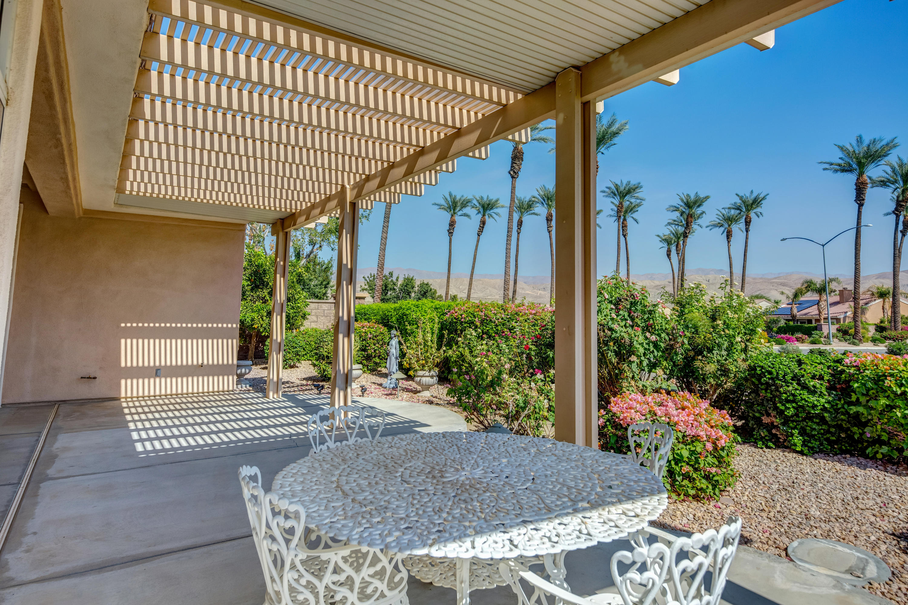 35076 Moorbrook Road Palm Desert, CA 92211 - Photo 39 of 45 a view of a porch with plants and garden