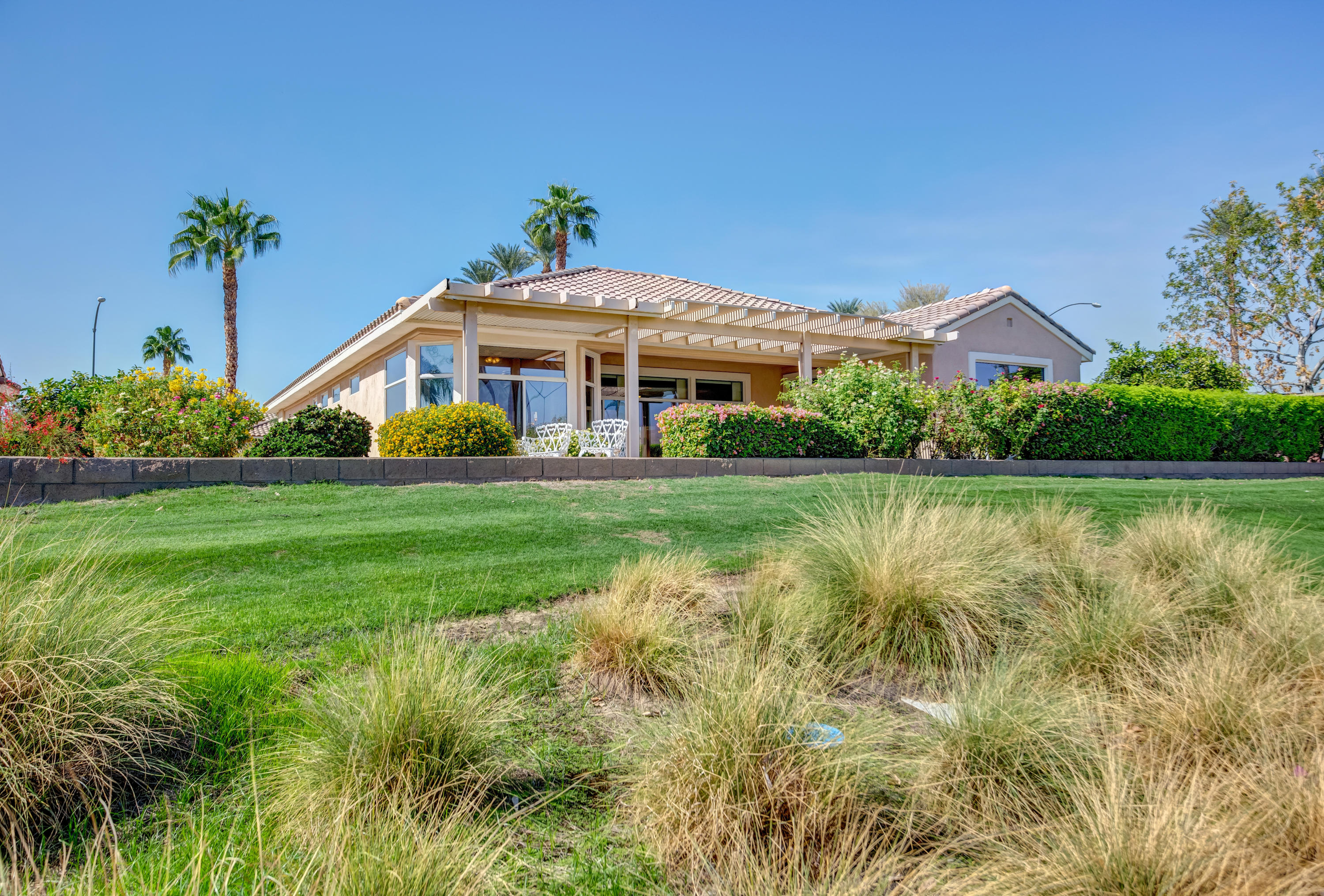 35076 Moorbrook Road Palm Desert, CA 92211 - Photo 42 of 45 a front view of a house with garden