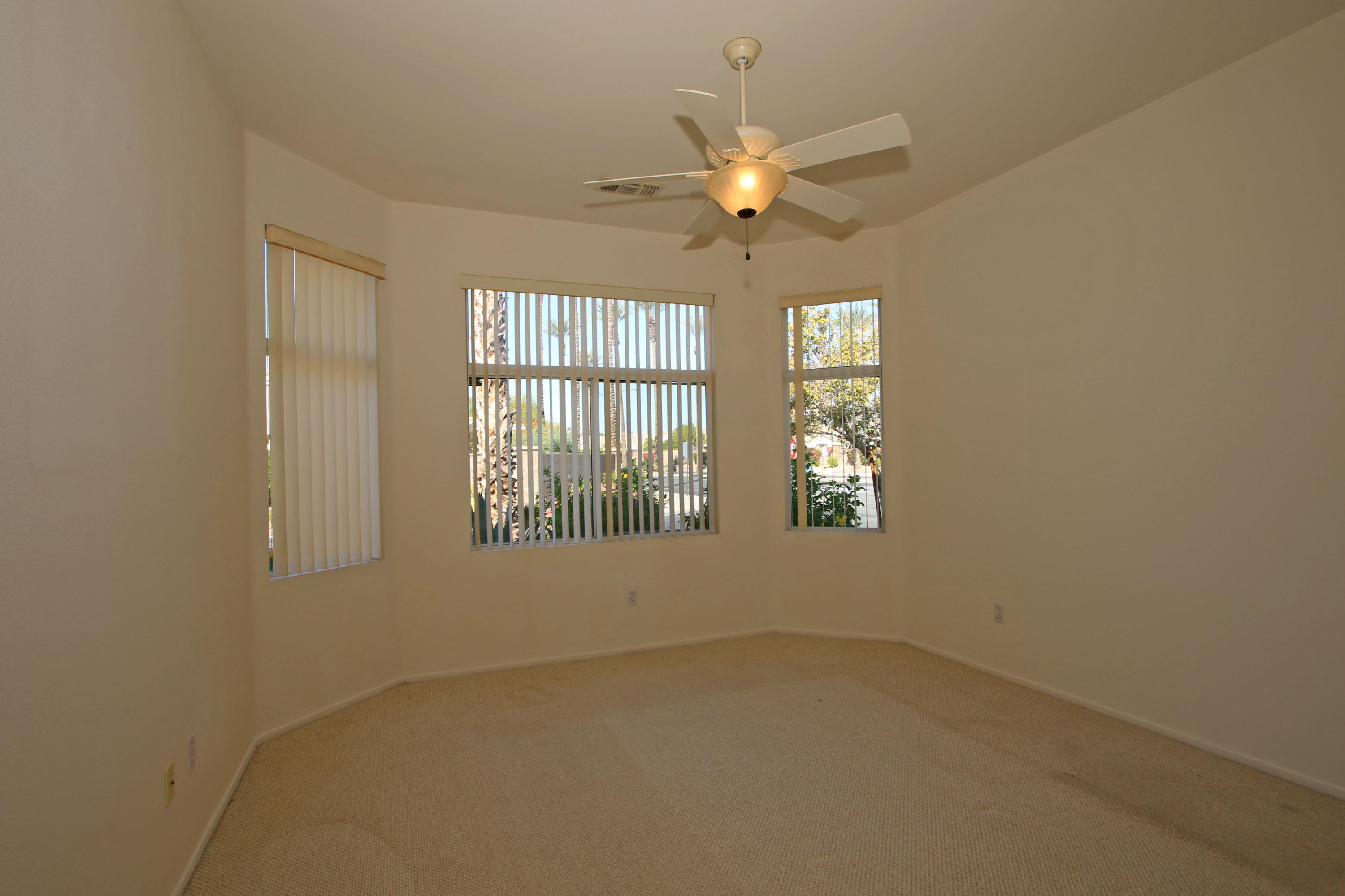 35076 Moorbrook Road Palm Desert, CA 92211 - Photo 45 of 45 an empty room with windows and fan