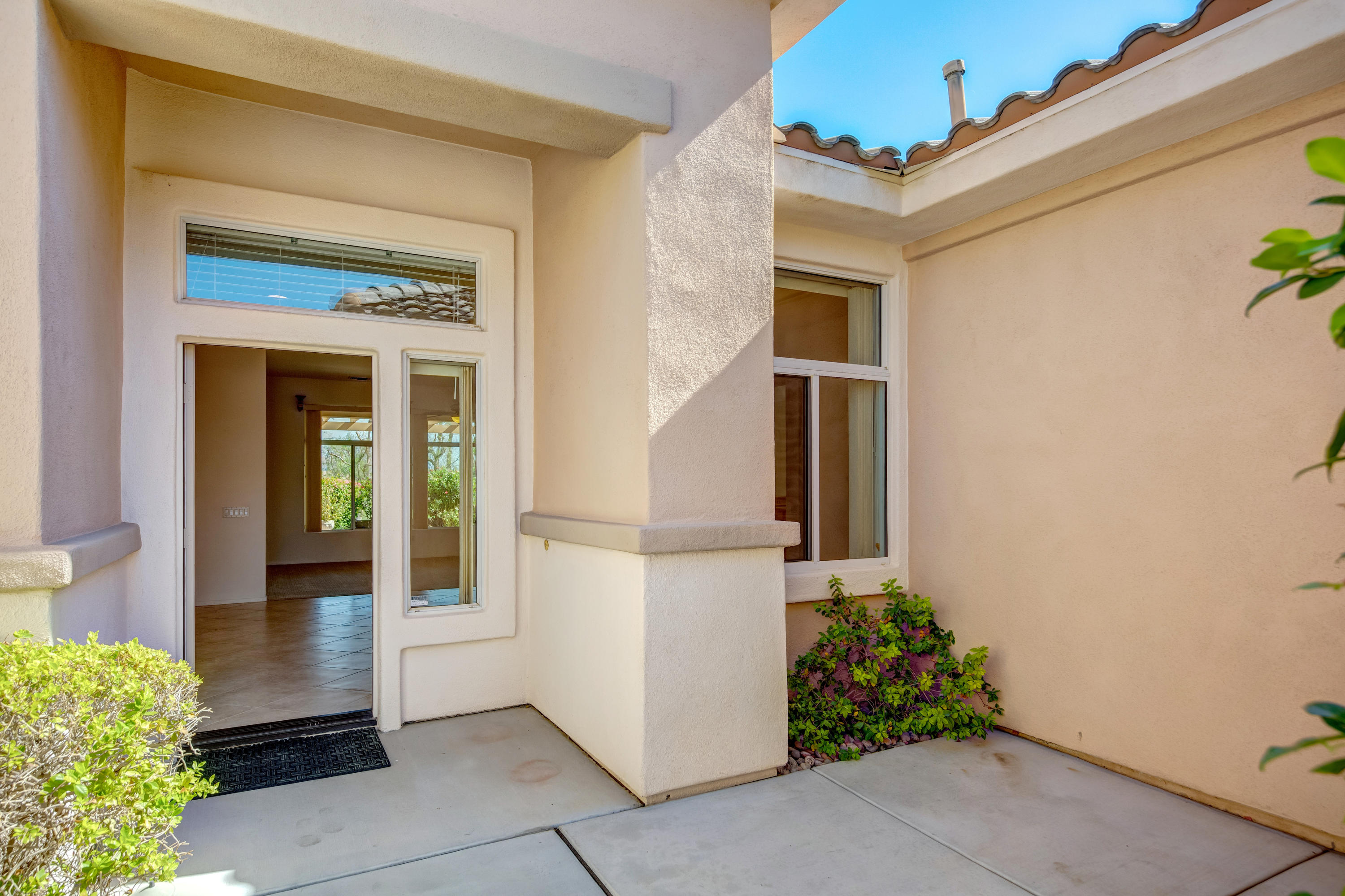 35076 Moorbrook Road Palm Desert, CA 92211 - Photo 7 of 45 a view of a entryway door of the house