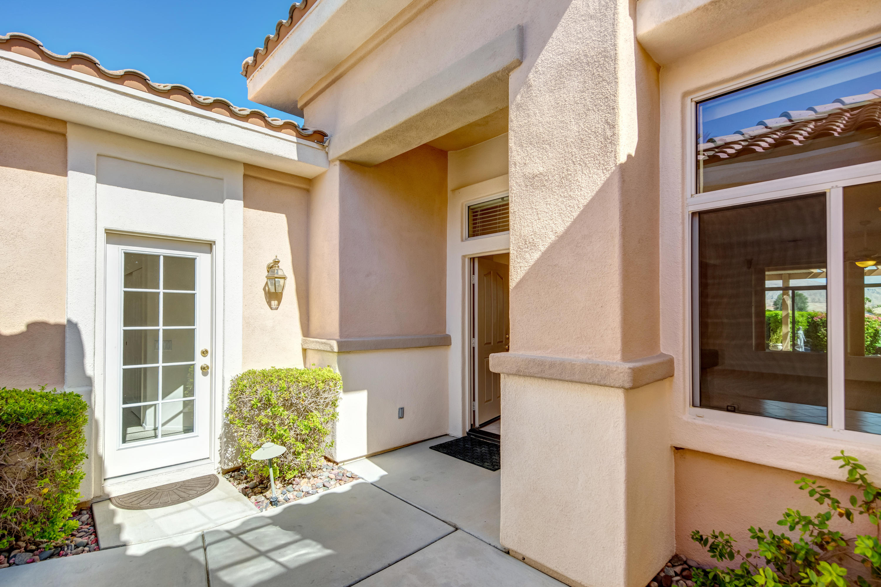 35076 Moorbrook Road Palm Desert, CA 92211 - Photo 8 of 45 a front view of a house with a garage
