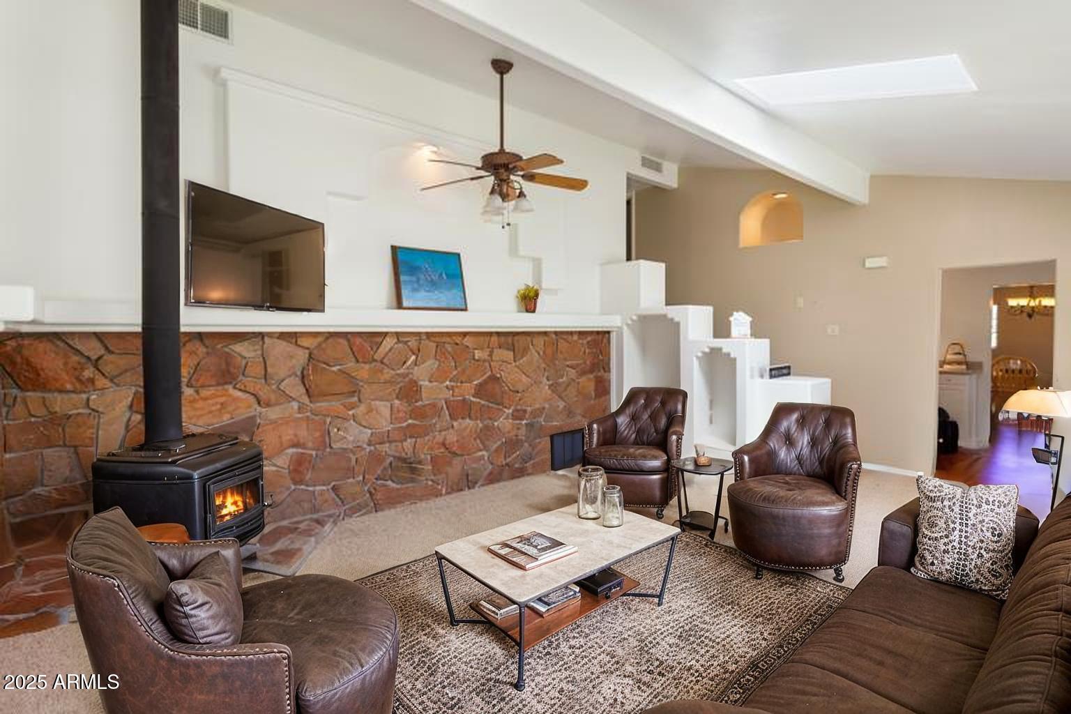 706 Shattuck Street Bisbee, AZ 85603 - Photo 11 of 55 a living room with furniture and a flat screen tv