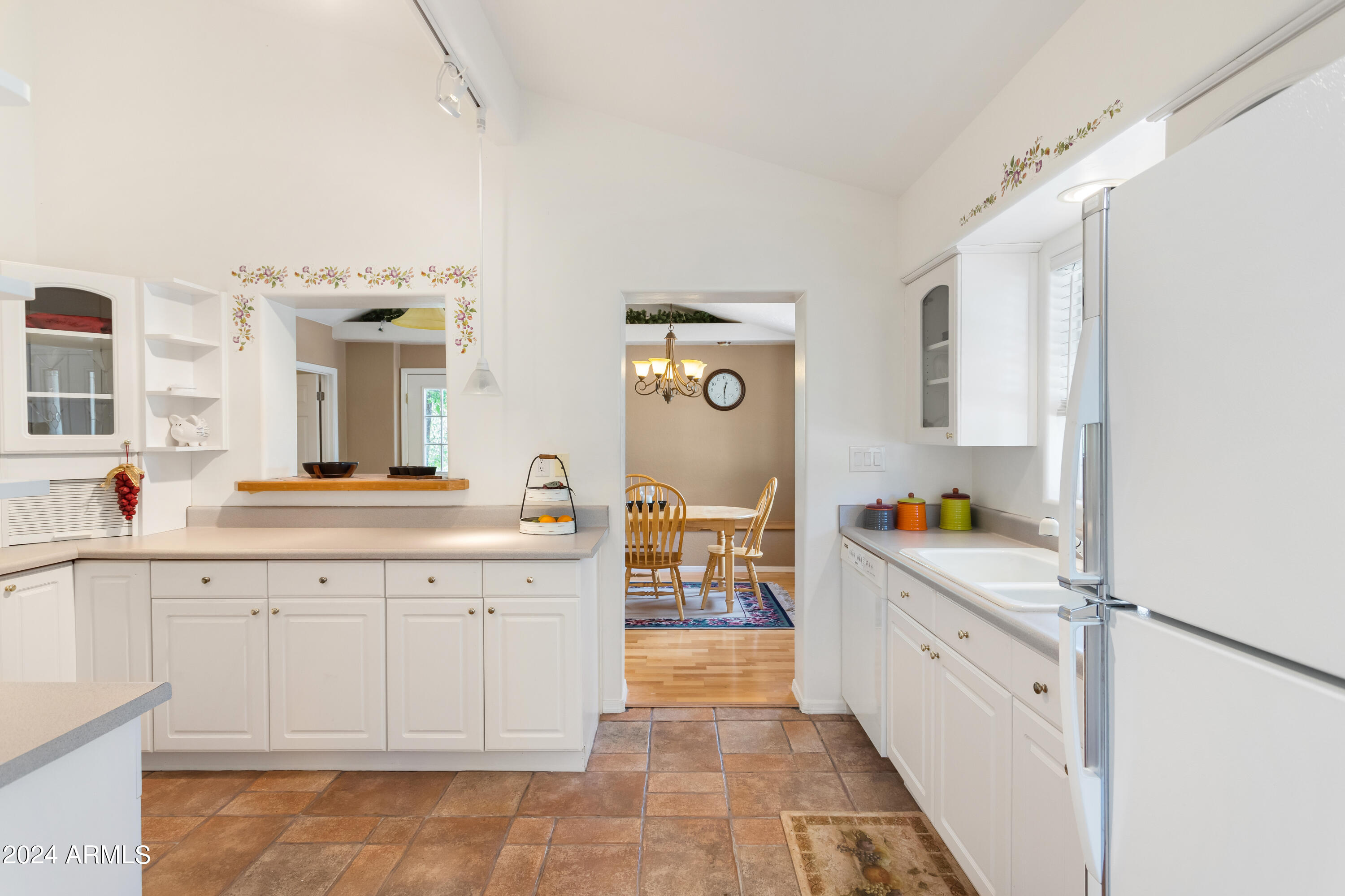 706 Shattuck Street Bisbee, AZ 85603 - Photo 13 of 55 a spacious bathroom with a granite countertop sink a mirror and a bathtub