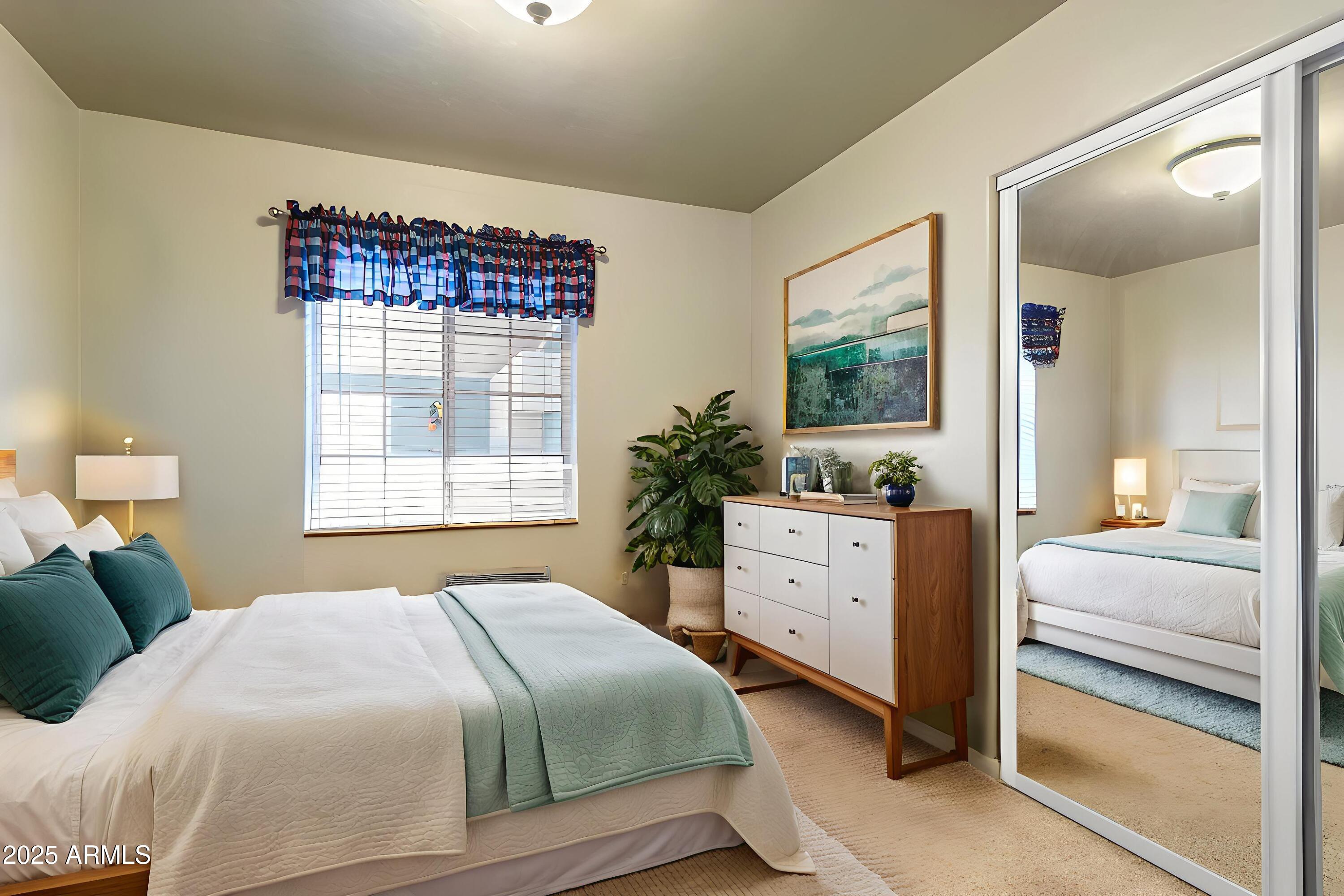 706 Shattuck Street Bisbee, AZ 85603 - Photo 19 of 55 a bedroom with a bed and a dresser