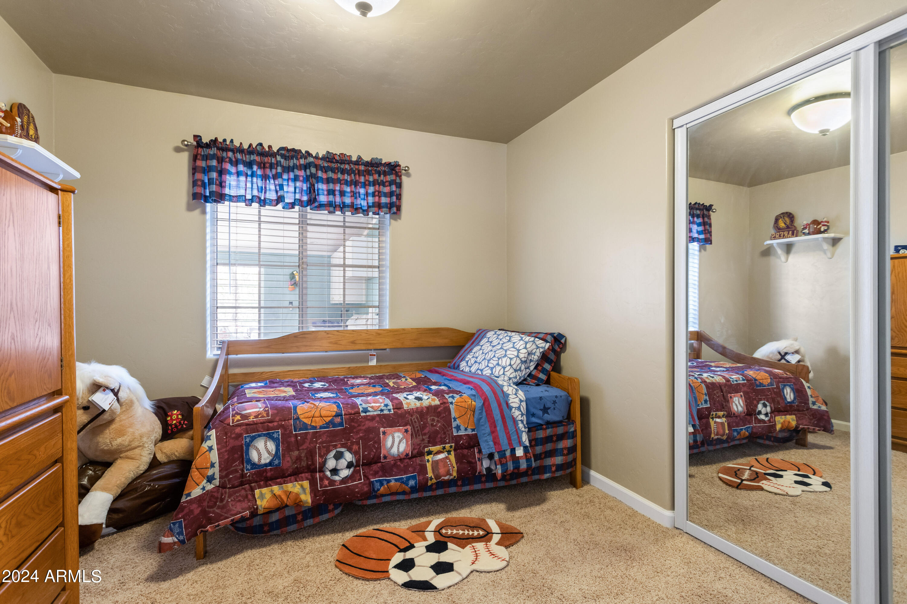 706 Shattuck Street Bisbee, AZ 85603 - Photo 20 of 55 a bedroom with a bed and a window