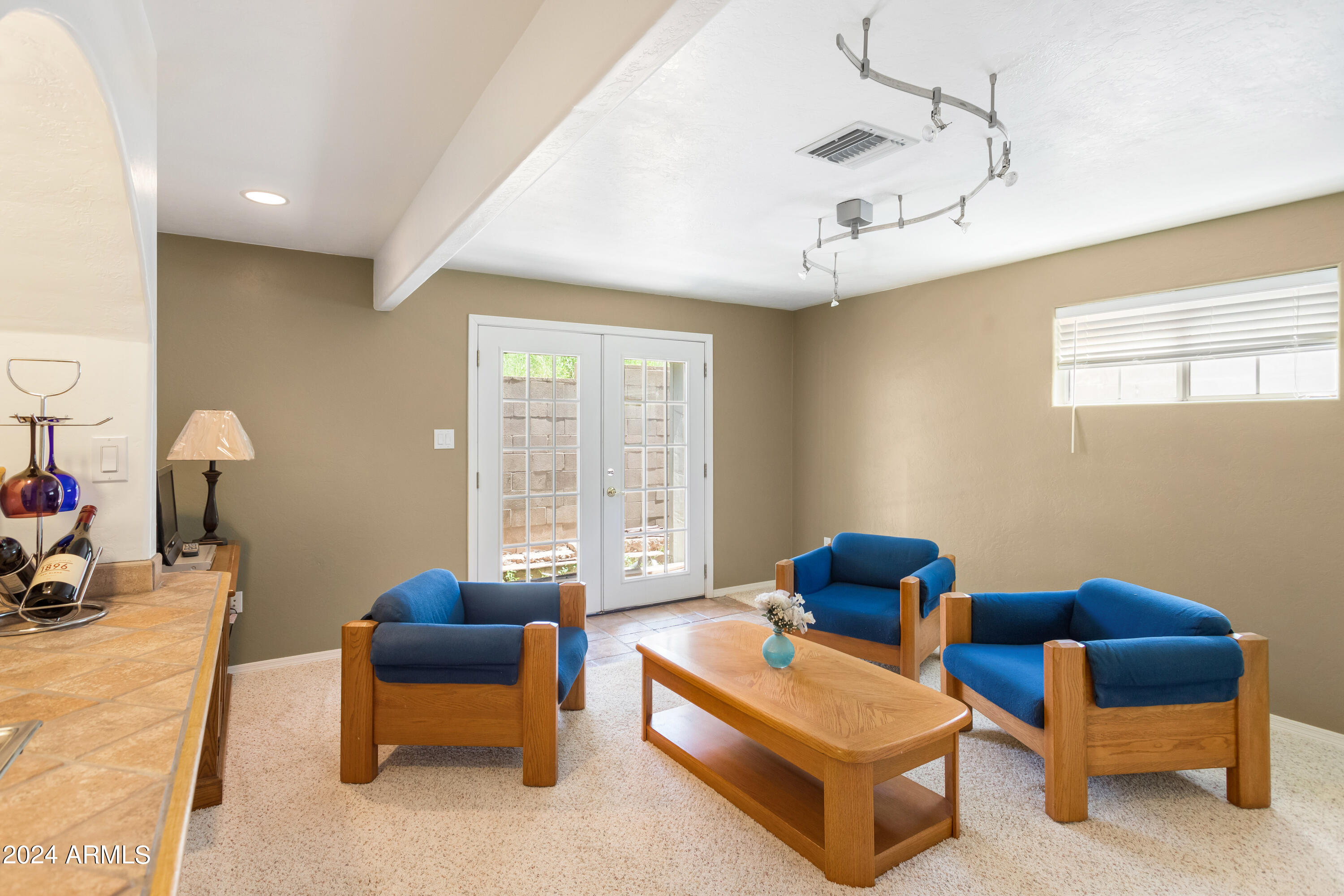 706 Shattuck Street Bisbee, AZ 85603 - Photo 25 of 55 a living room with furniture and a window