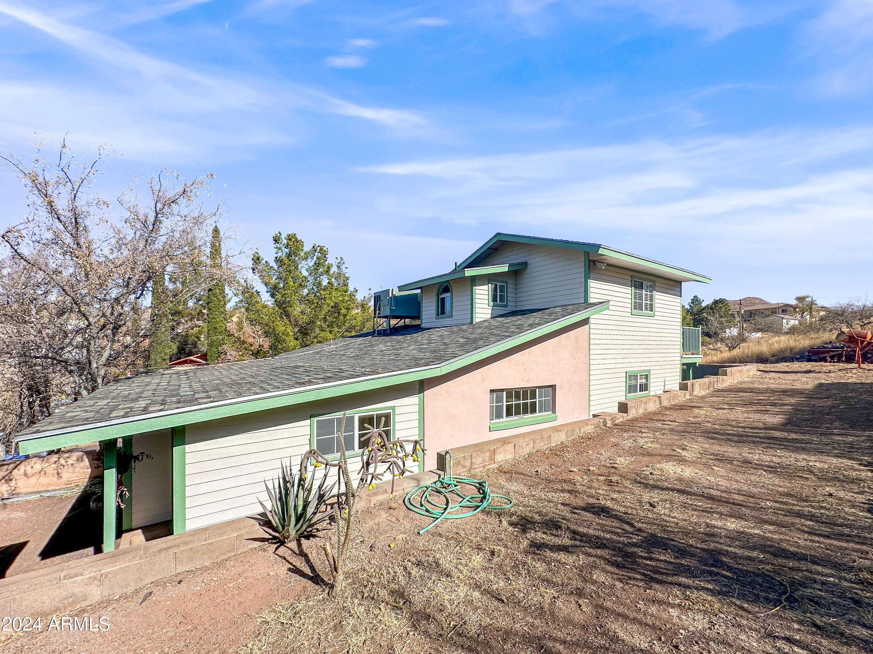 706 Shattuck Street Bisbee, AZ 85603 - Photo 42 of 55 a view of a house with a backyard