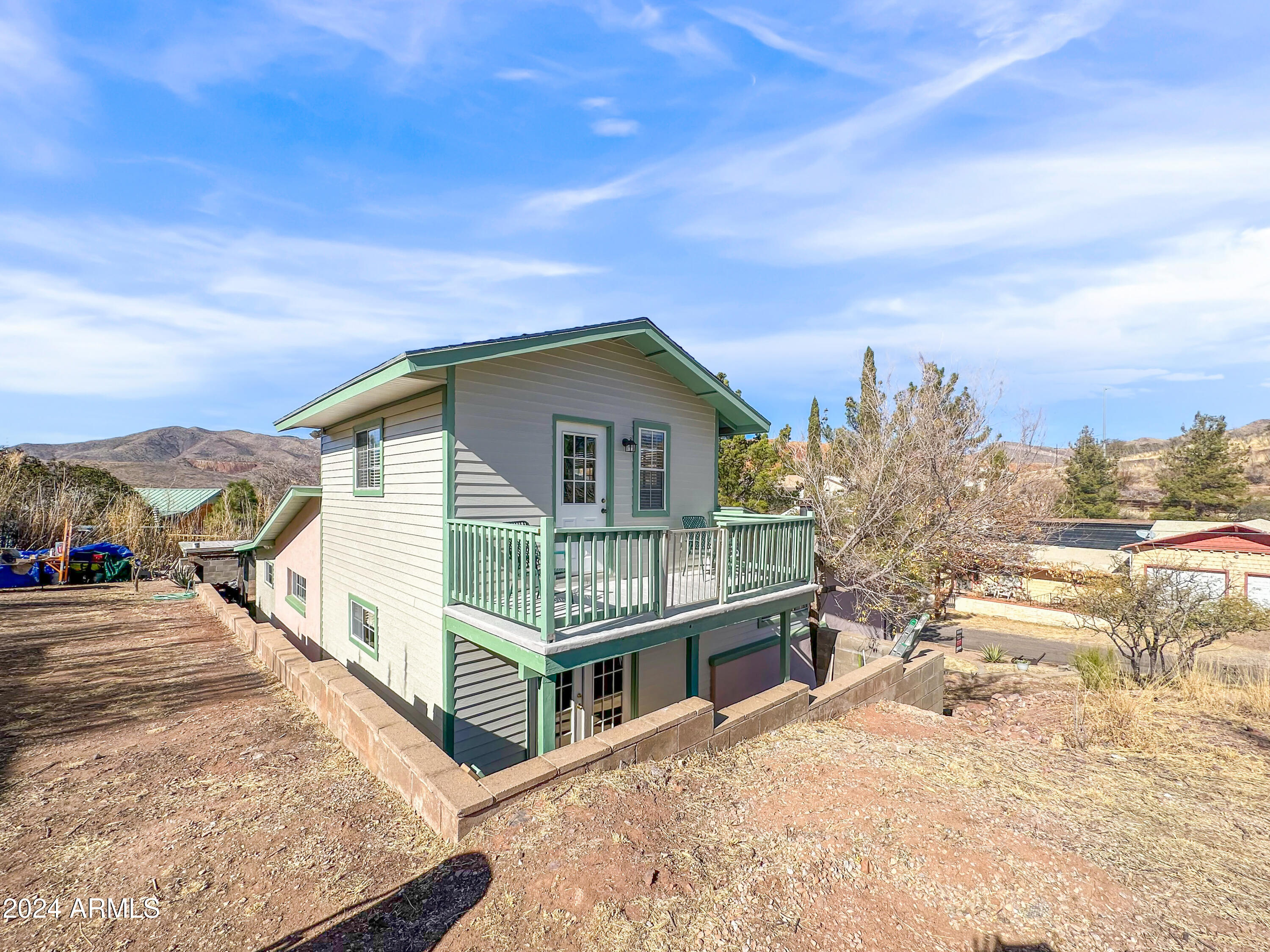 706 Shattuck Street Bisbee, AZ 85603 - Photo 43 of 55 a view of a house with wooden floor roof and covered with snow in front of house