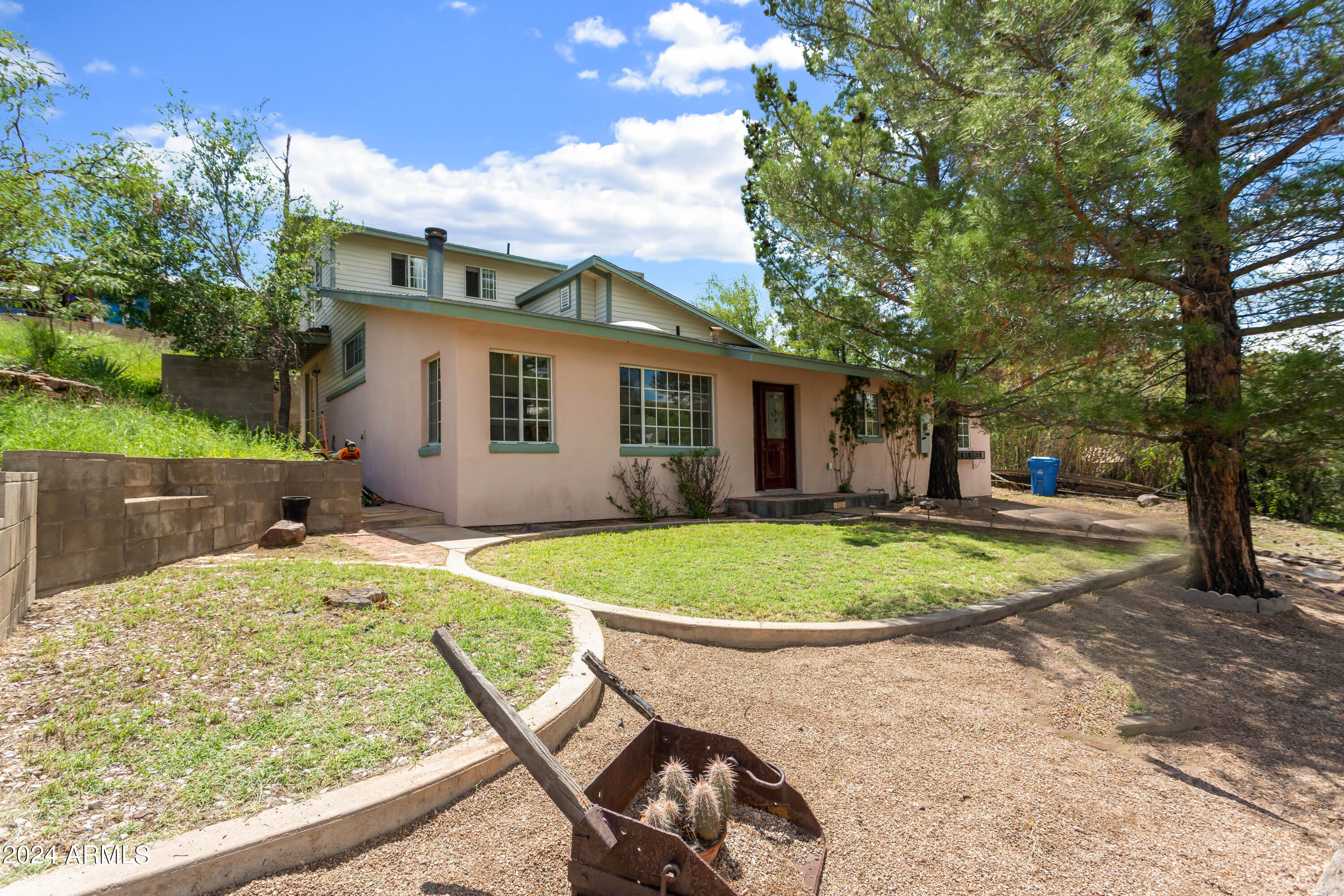 706 Shattuck Street Bisbee, AZ 85603 - Photo 45 of 55 a view of a backyard with table and chairs under an umbrella