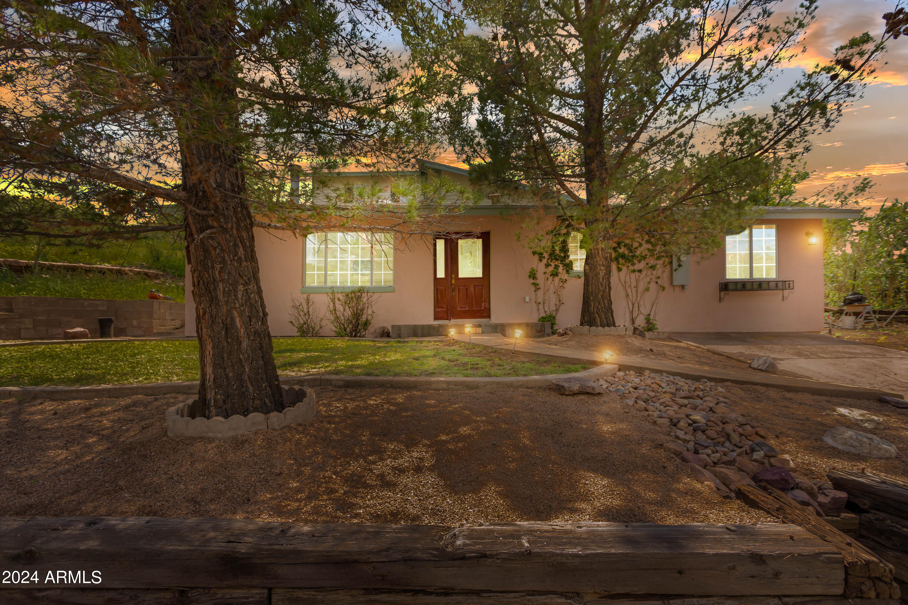 706 Shattuck Street Bisbee, AZ 85603 - Photo 50 of 55 a view of a house with backyard and trees