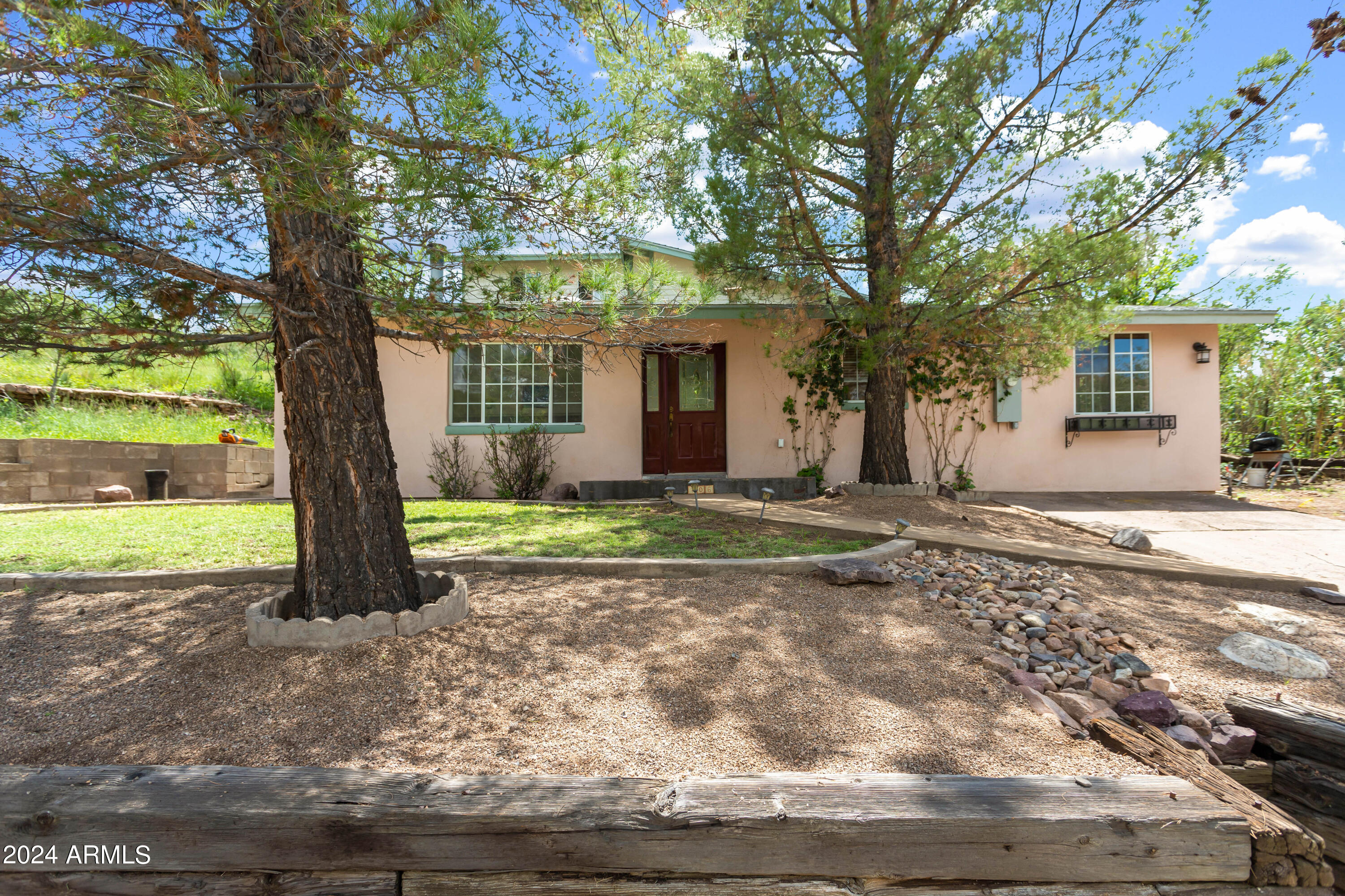 706 Shattuck Street Bisbee, AZ 85603 - Photo 51 of 55 a view of a house with backyard and trees