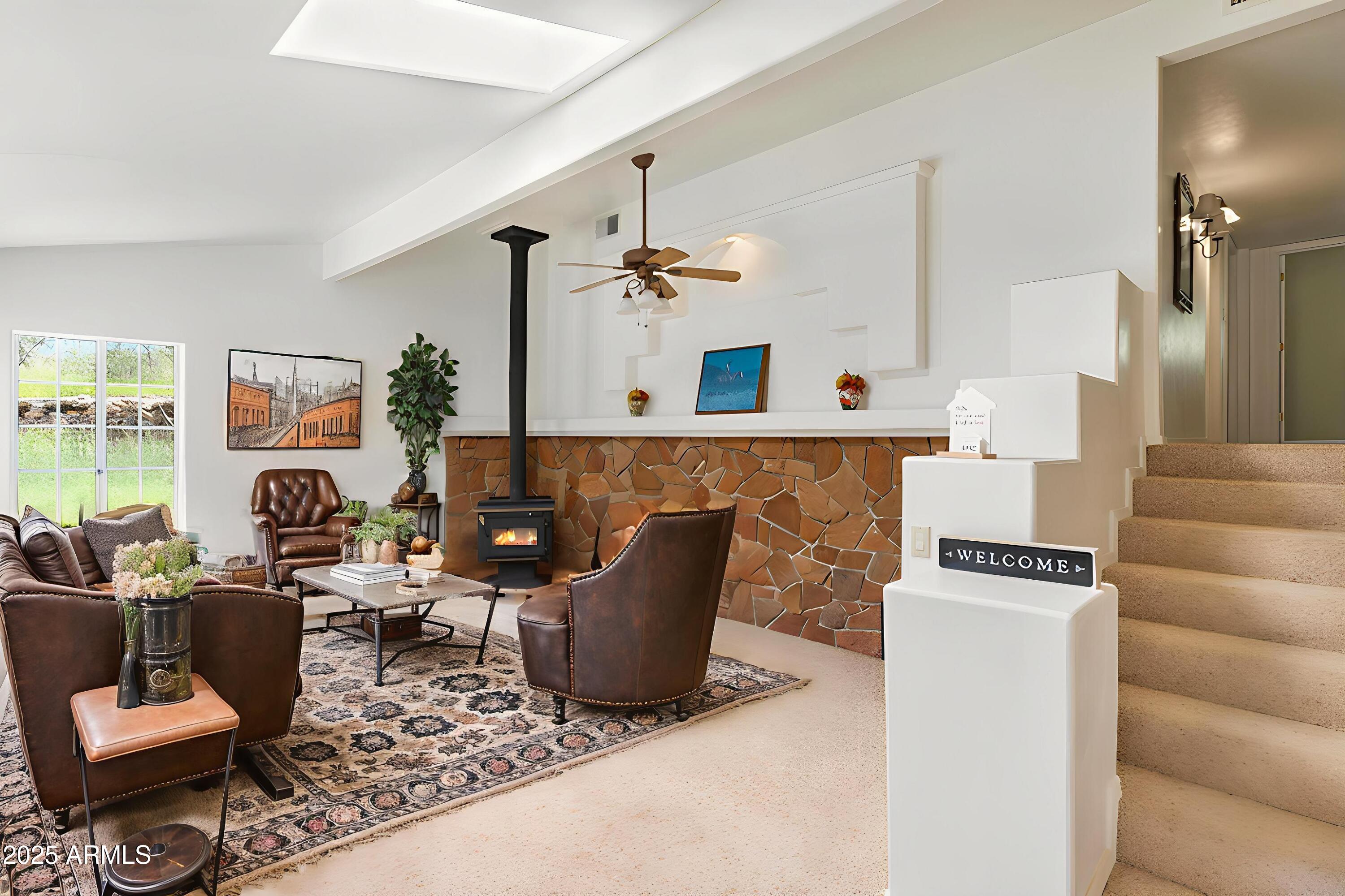 706 Shattuck Street Bisbee, AZ 85603 - Photo 6 of 55 a living room with furniture and a fireplace