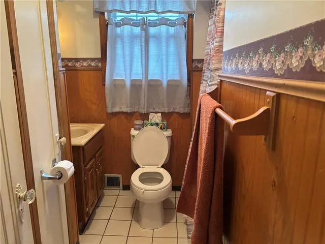 a bathroom with a toilet and a sink