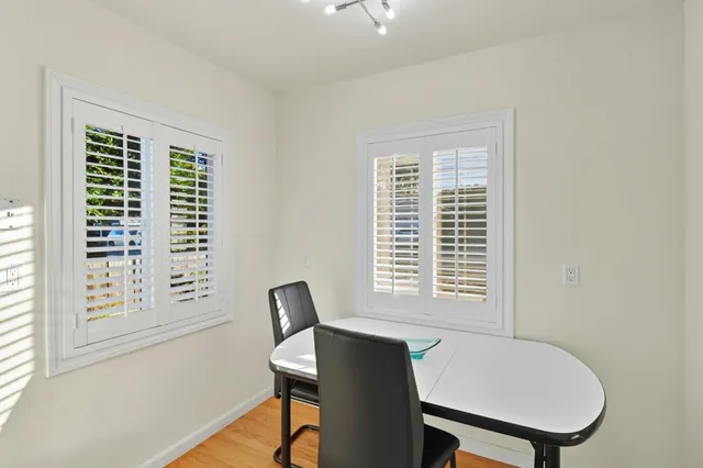 a view of kitchen with furniture and wooden floor