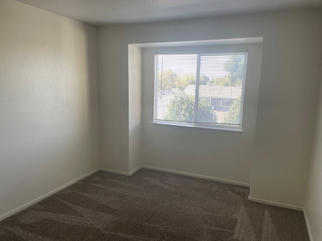 565 Peerless Way, Unit 108 Tracy, CA 95376 - Photo 11 of 15 an empty room with a window