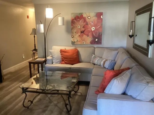 a living room with furniture and a fireplace