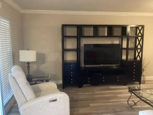 a kitchen with granite countertop a stove a sink and a microwave