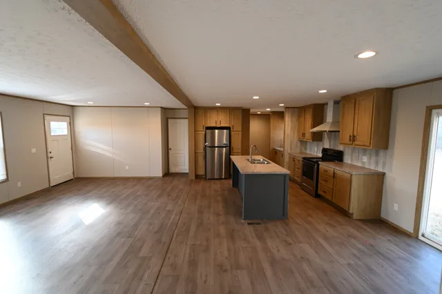 a bathroom with a granite countertop toilet a sink and a mirror