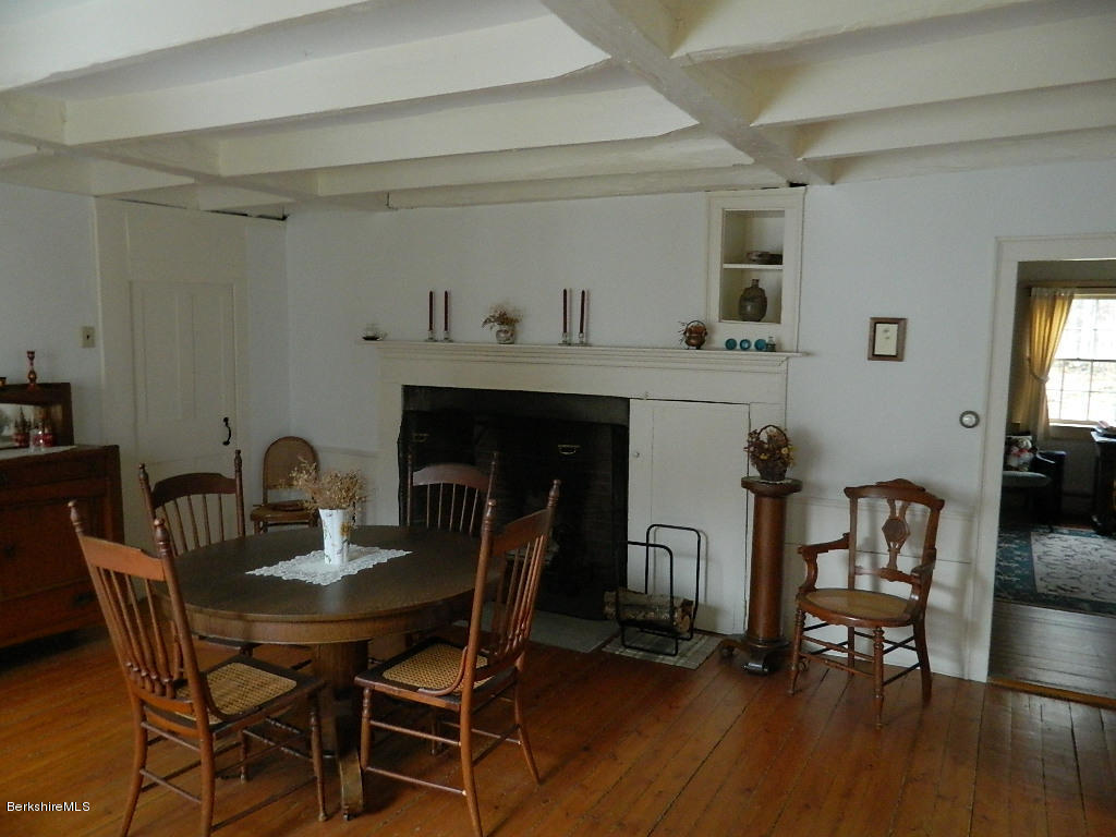 230 Middlefield Road Washington, MA 01223 - Photo 8 of 40 a dining room with furniture and wooden floor