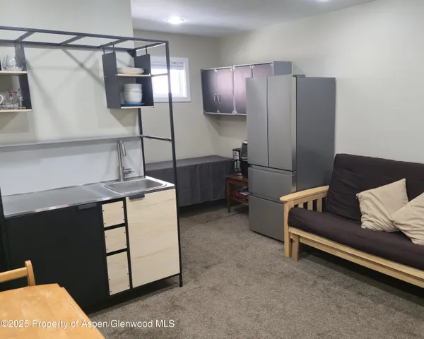 a bedroom with furniture and a couch