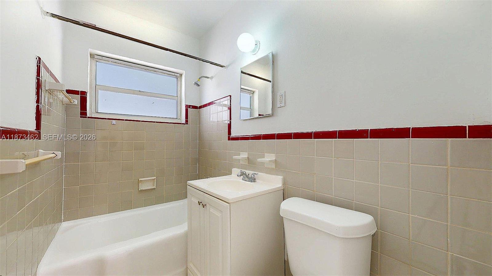 2499 Southwest 27th Street, Unit 7 Miami, FL 33133 - Photo 13 of 16 a bathroom with a sink toilet and shower