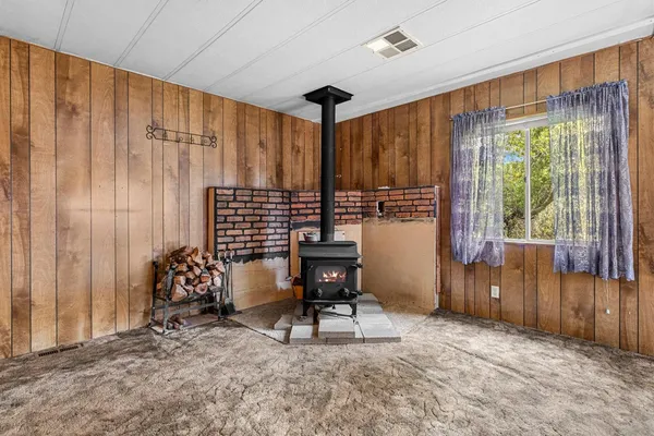 a kitchen with stainless steel appliances wooden cabinets a stove and a refrigerator